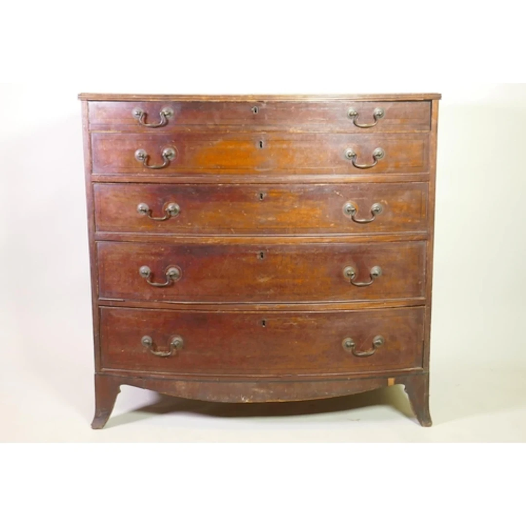 A George III/William IV mahogany bowfront chest of five long...