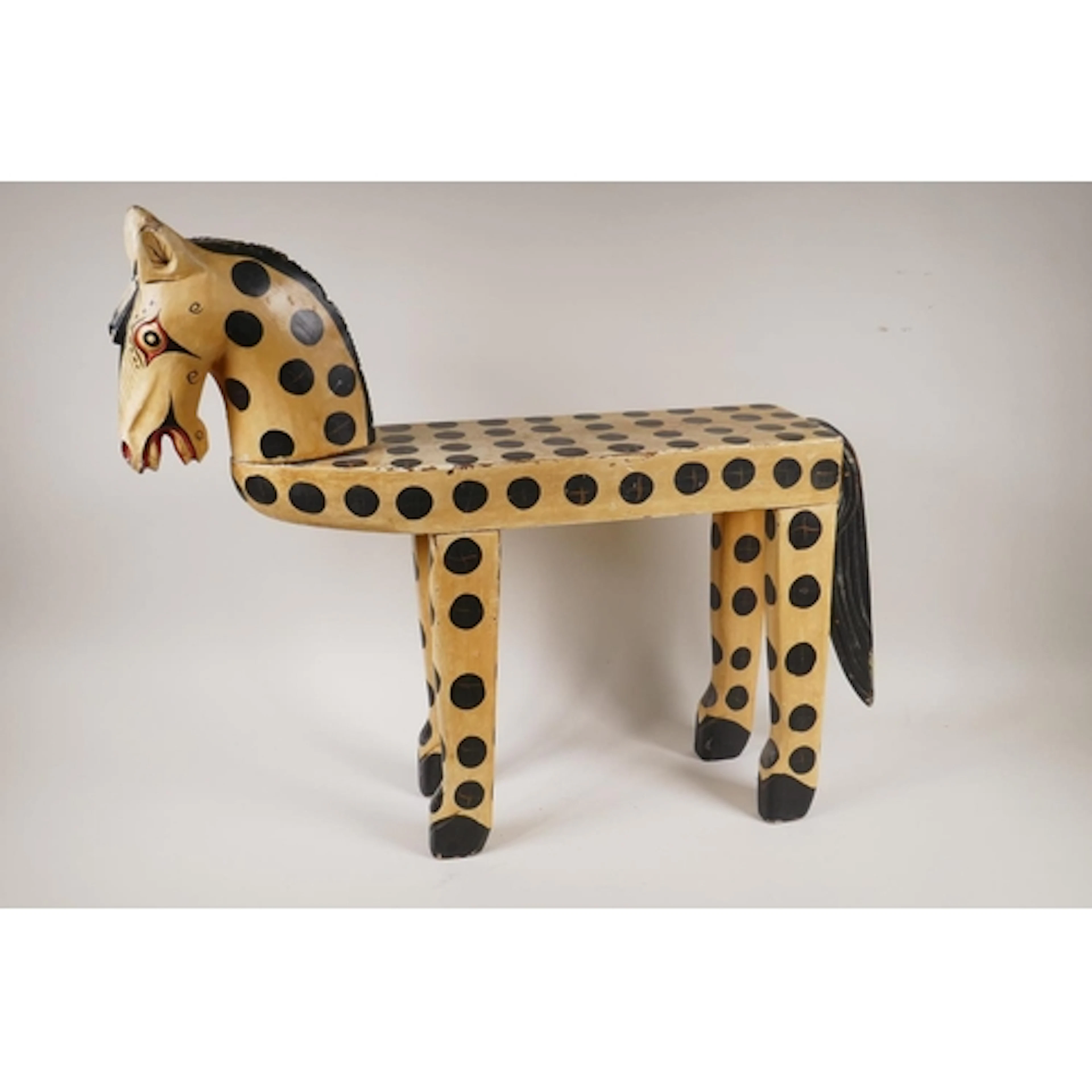 A vintage folk art painted wood table/stool in the form of a...