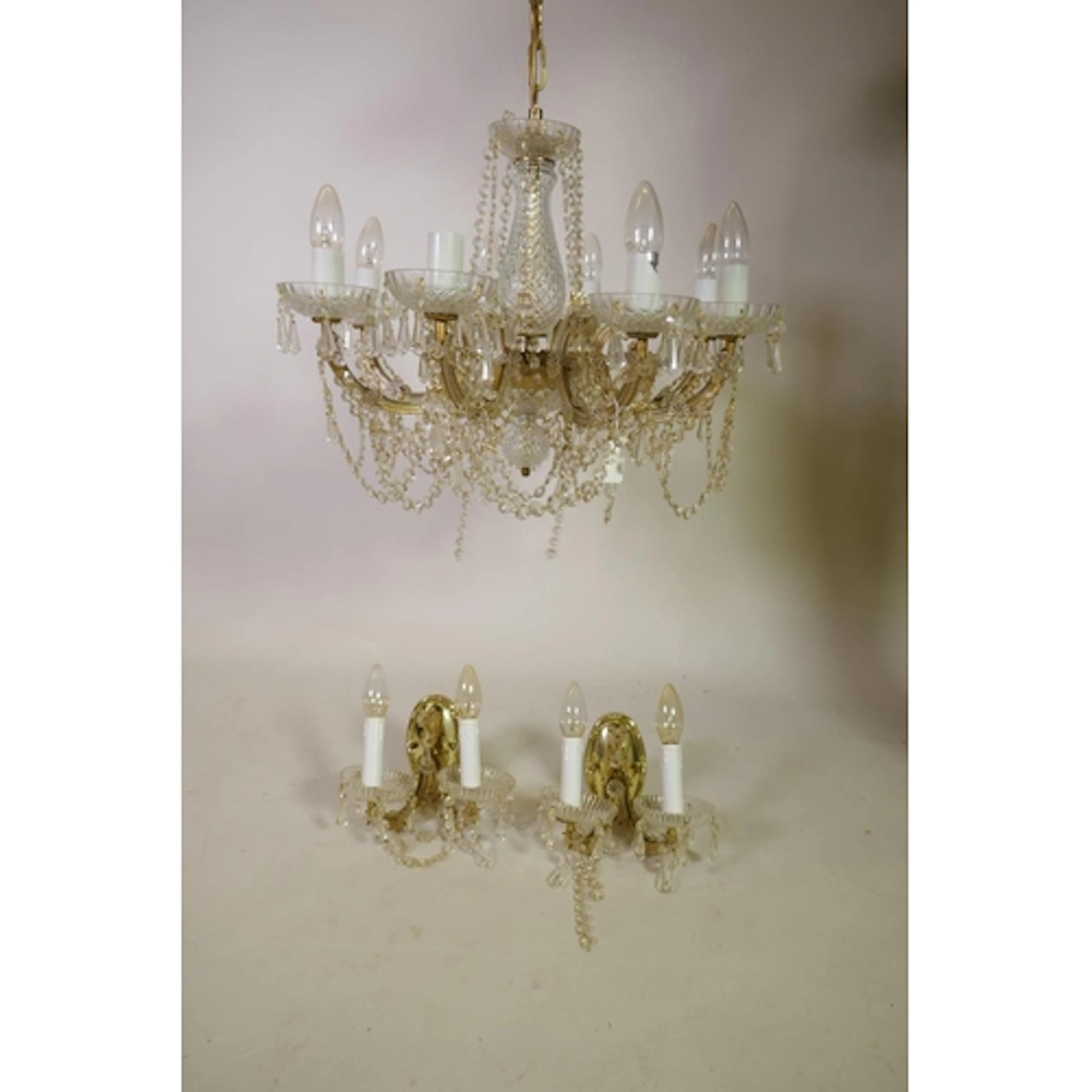 A vintage brass and glass eight branch chandelier and a pair...