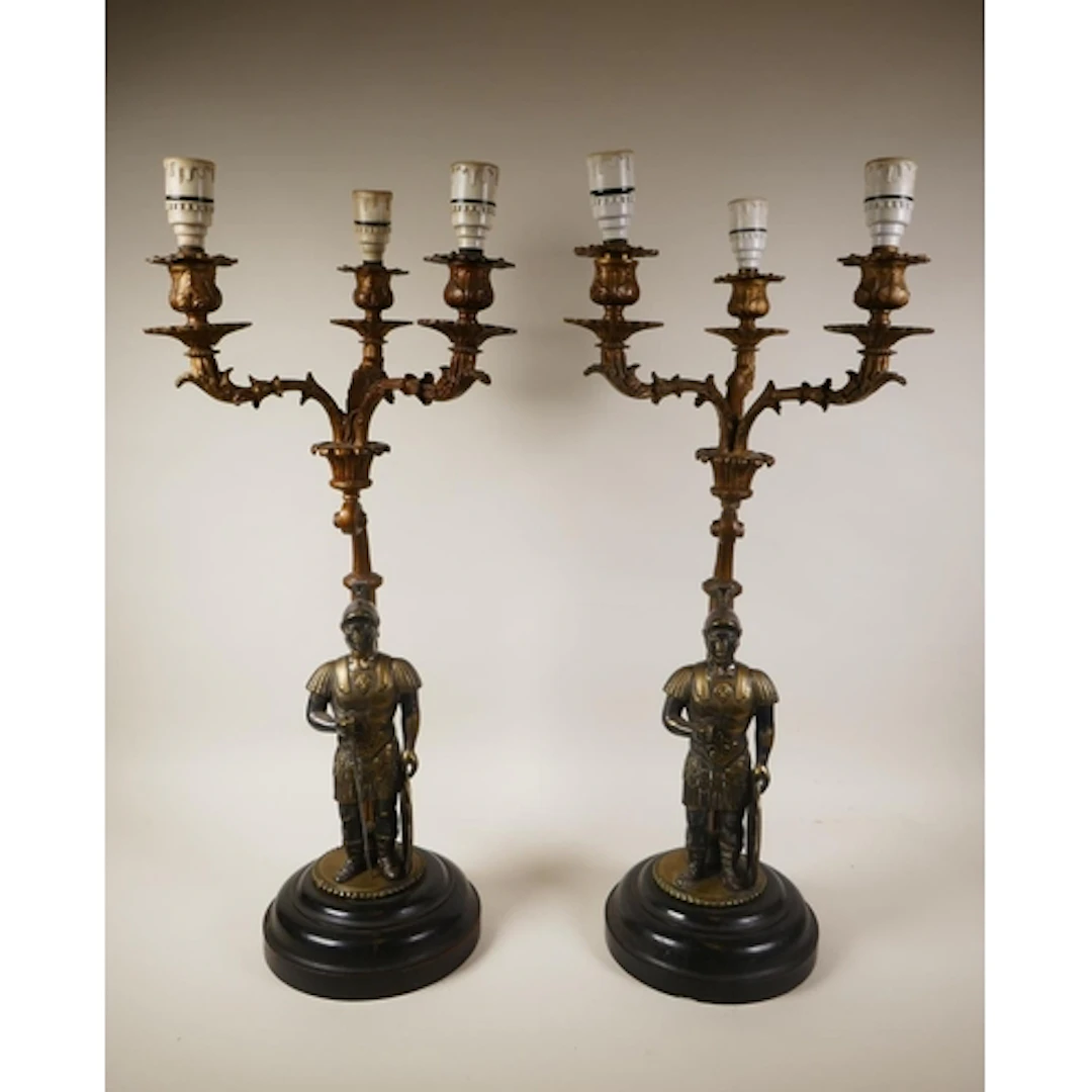 A pair of French empire style bronze three branch lamps deco...