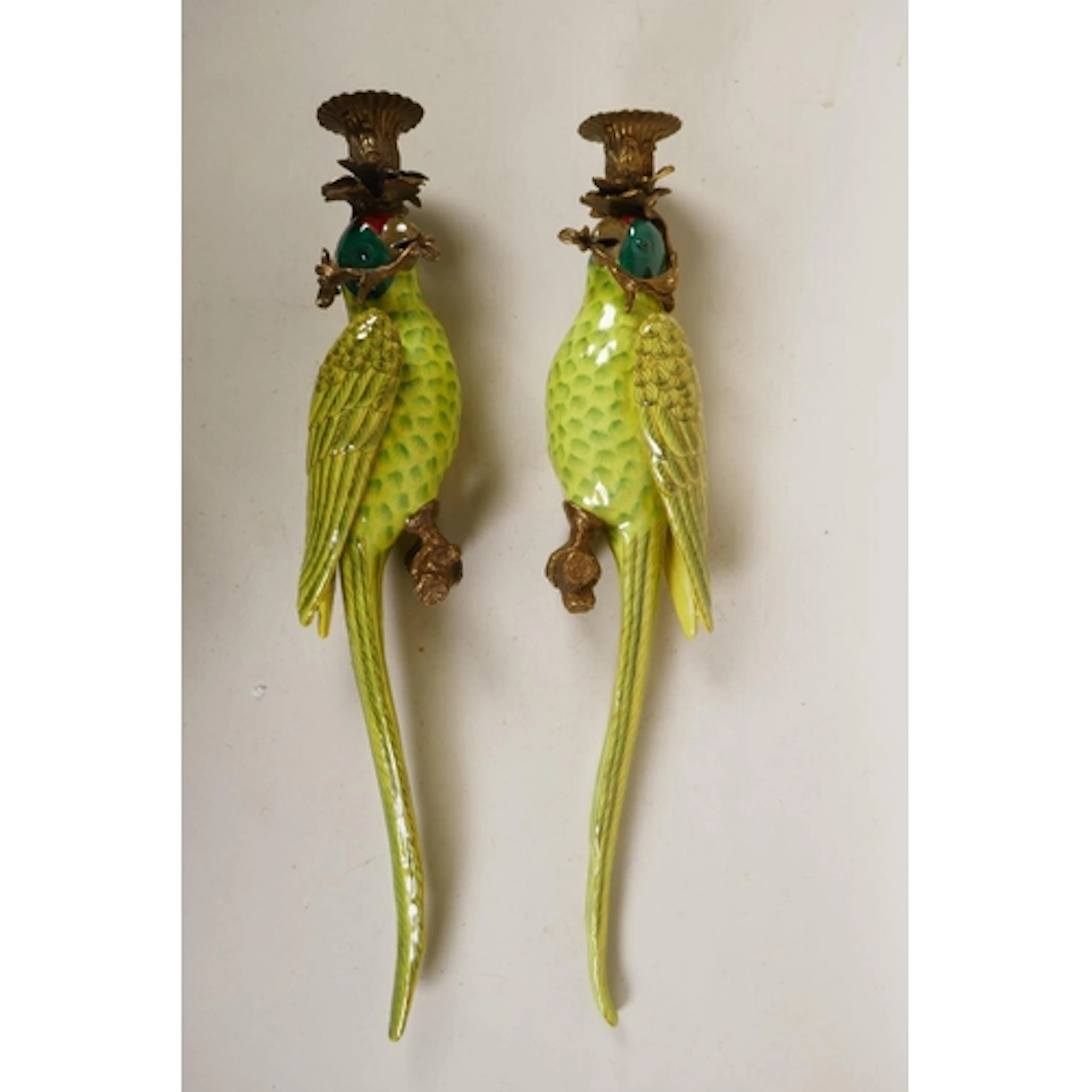 A pair of polychrome porcelain parrot wall sconces with gilt...