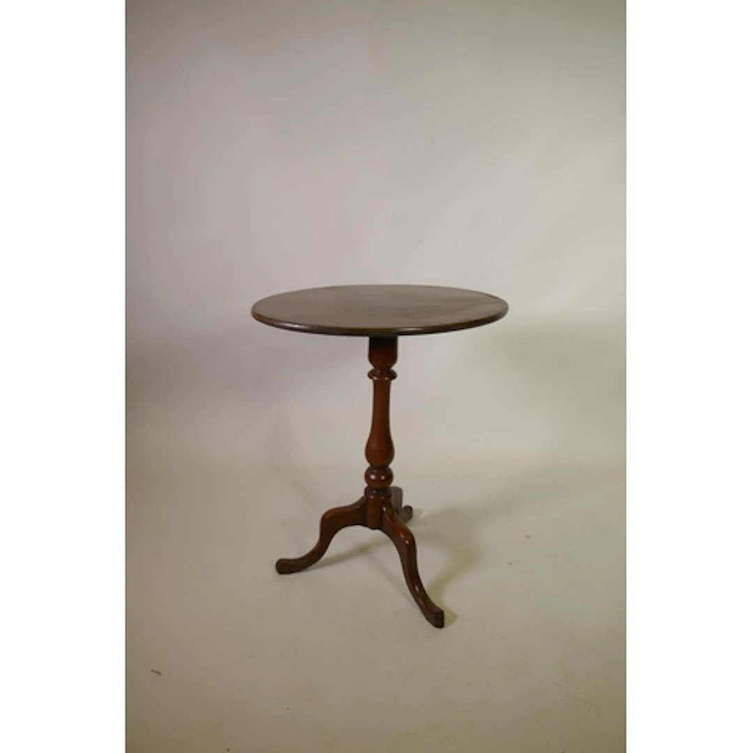 Early C19th mahogany tilt top wine table with oval top, rais...