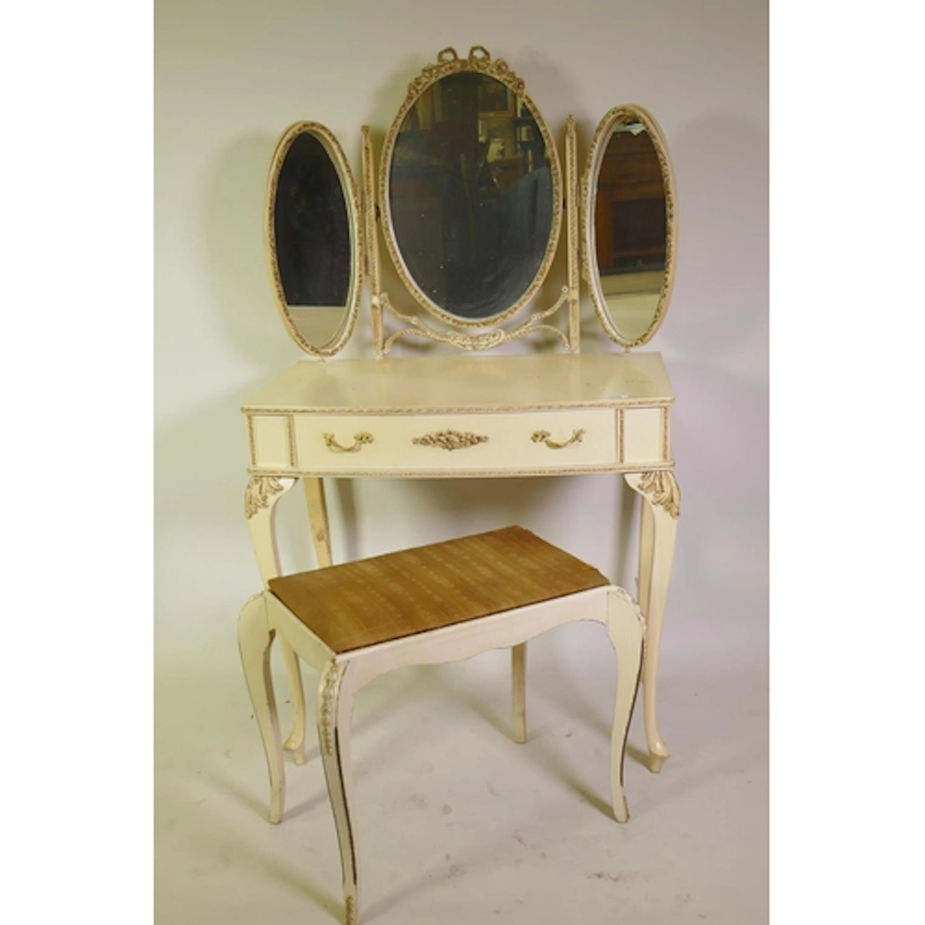 A 'Maple' French style painted and parcel gilt bow fronted d...