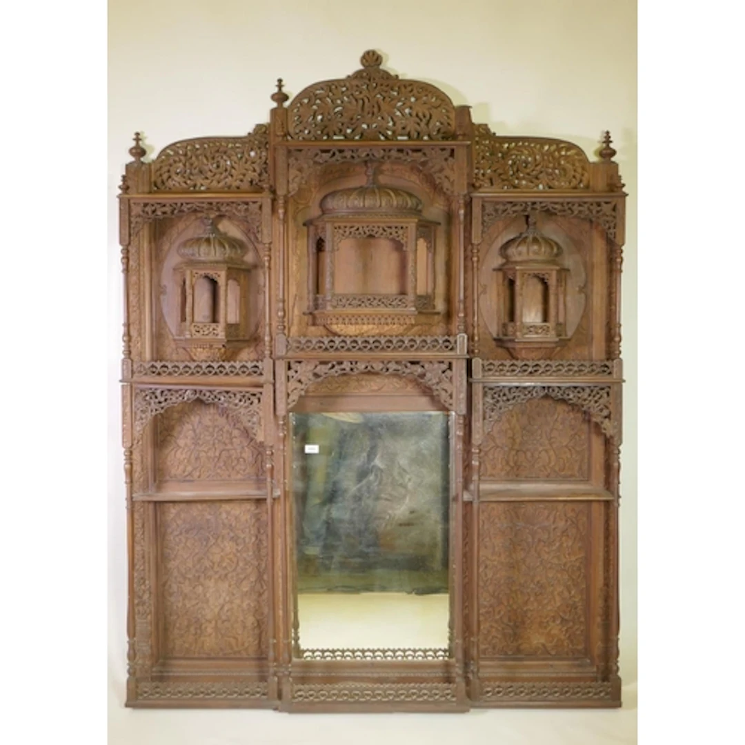 A C19th Burmese hand carved hardwood overmantel mirror, with...