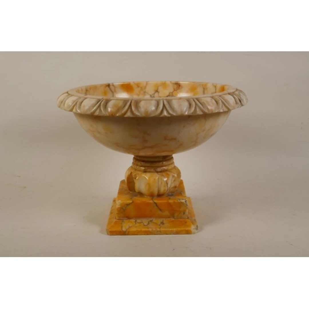 A carved alabaster footed pedestal bowl centrepiece, 20cm hi...