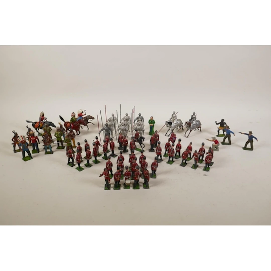 A collection of Britains painted lead soldiers, knights, cow...