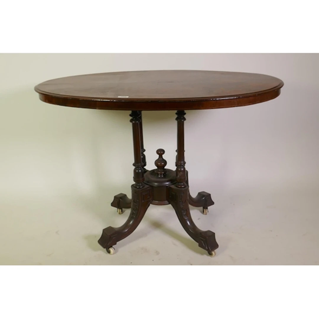 A Victorian inlaid burr walnut oval shaped tilt top table, r...