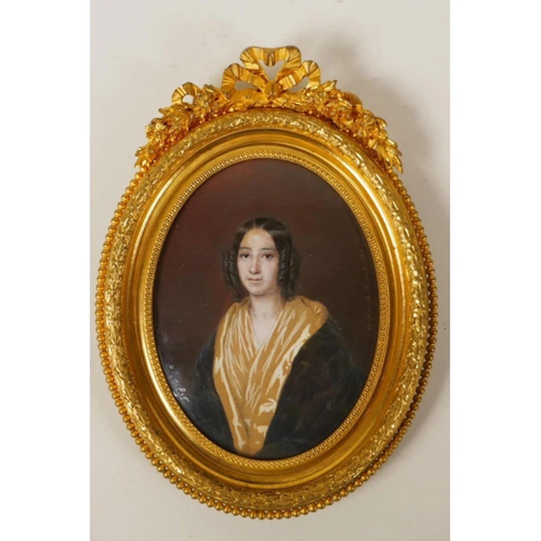 A C19th miniature portrait on card of a lady, named and date...