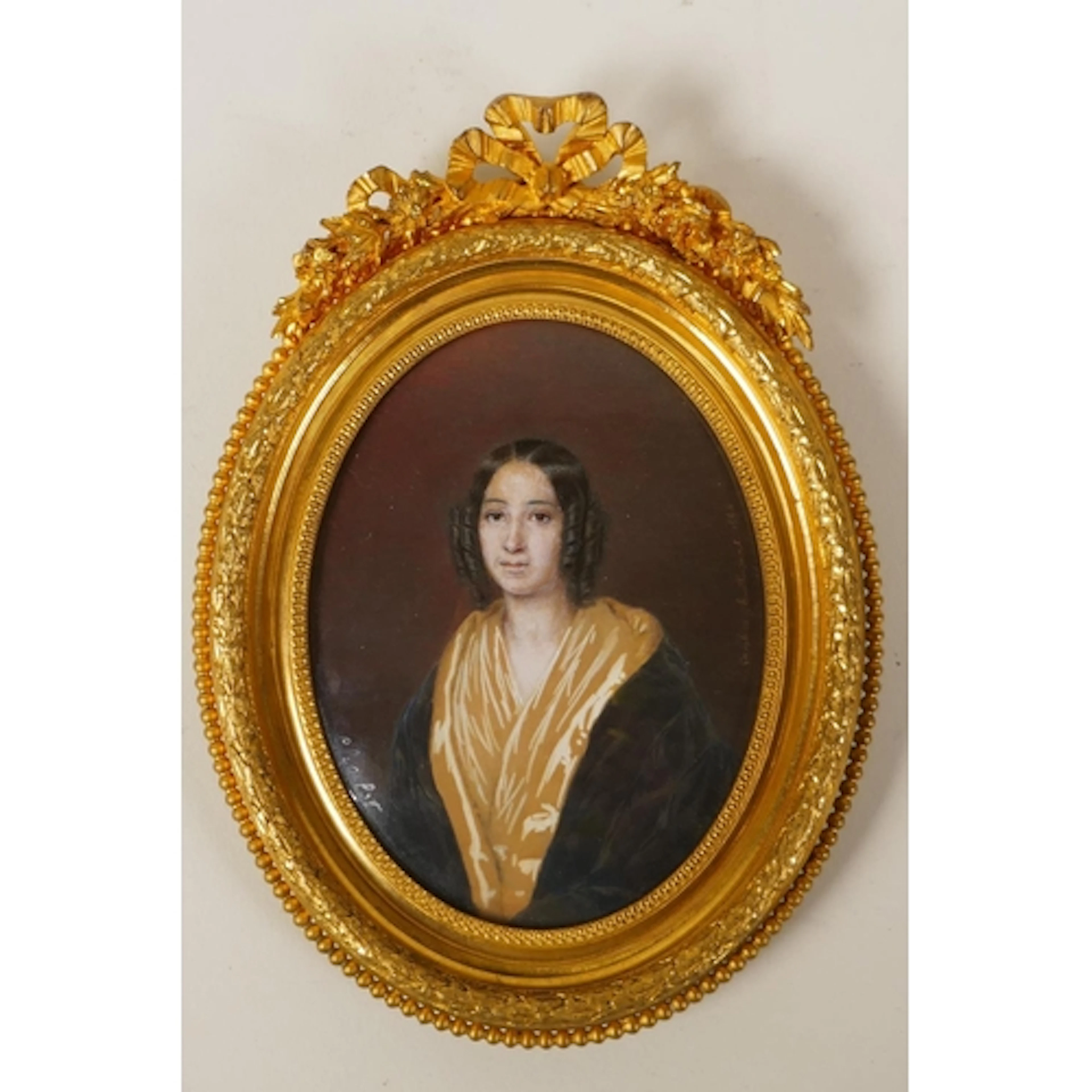 A C19th miniature portrait on card of a lady, named and date...