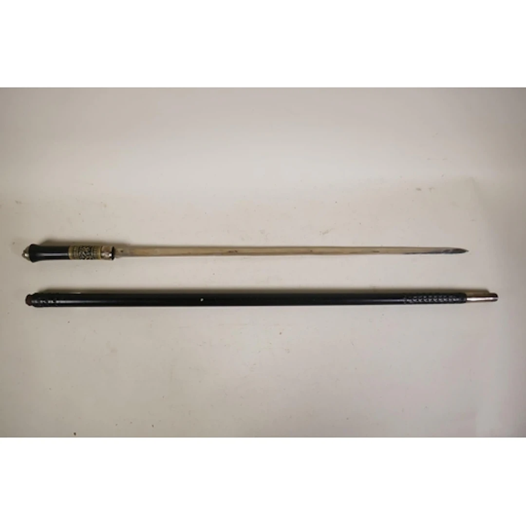 A hardwood Anglo Indian sword stick/walking cane with white ...
