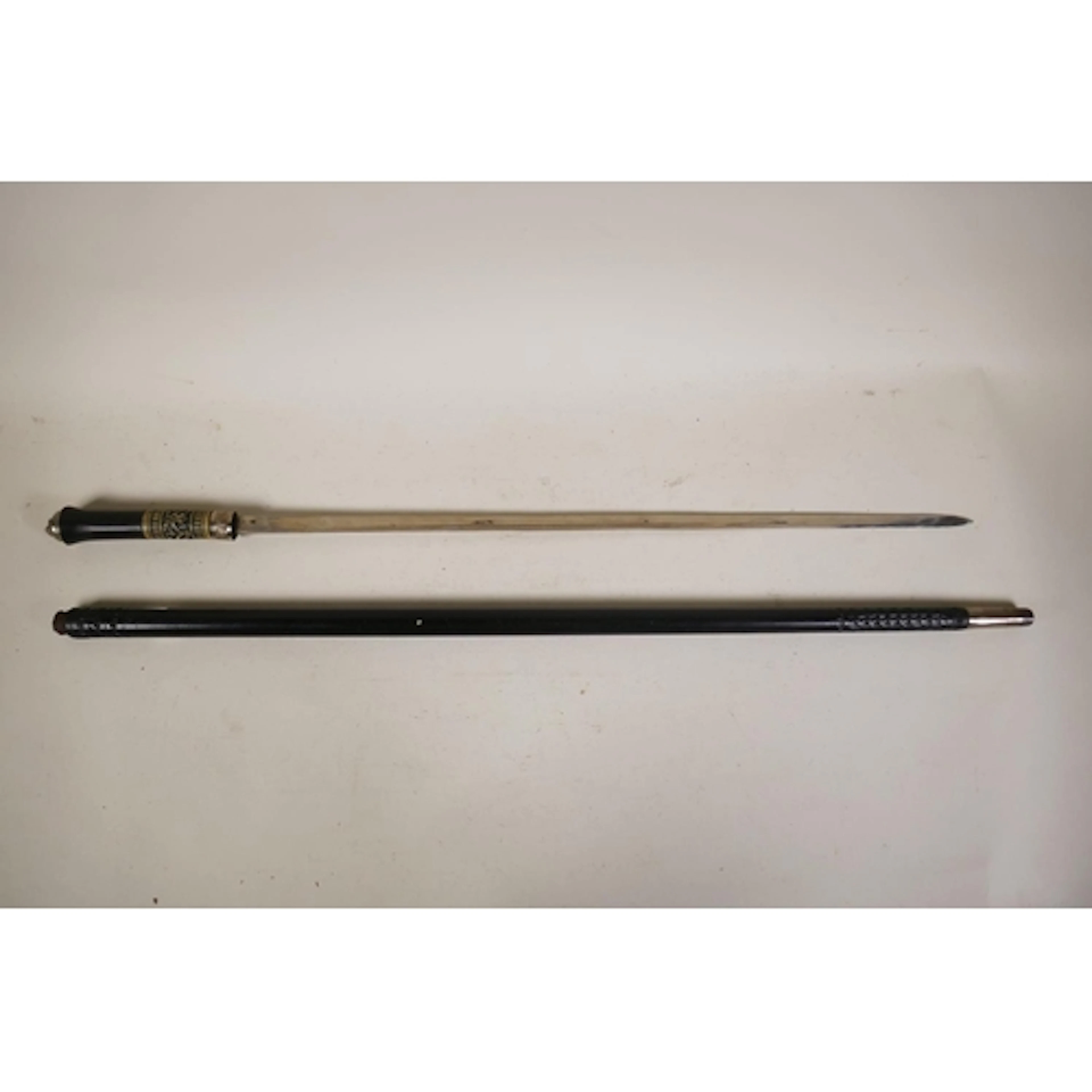 A hardwood Anglo Indian sword stick/walking cane with white ...