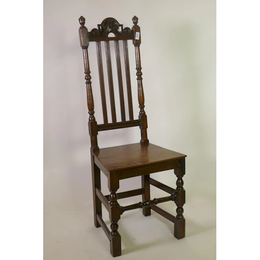 Antique oak side chair with carved rail and reeded lathe bac...