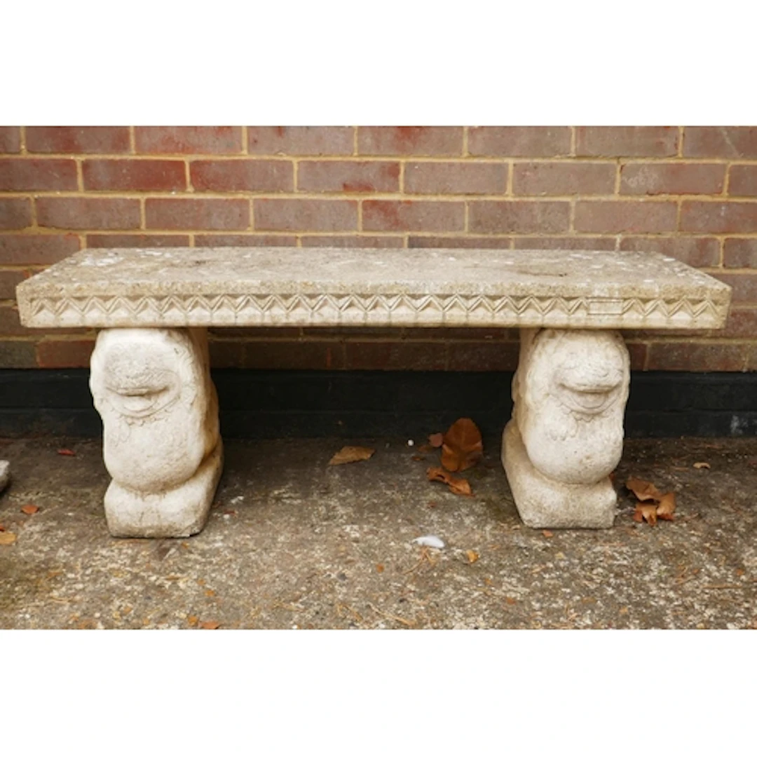 A concrete garden bench raised on lion supports, 120 x 40 x ...