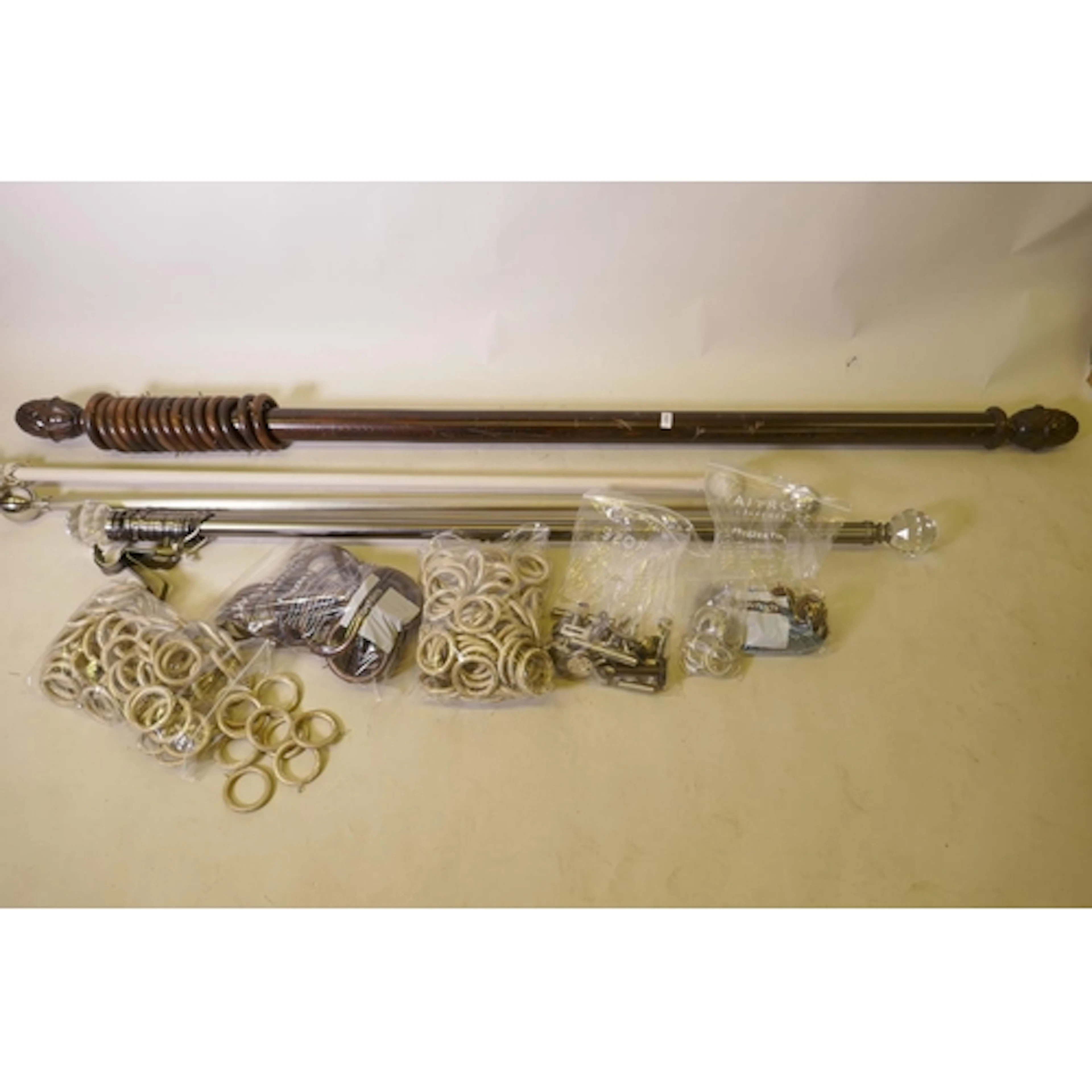 A wood curtain pole, 190cm long, 230cm with finials, brushed...