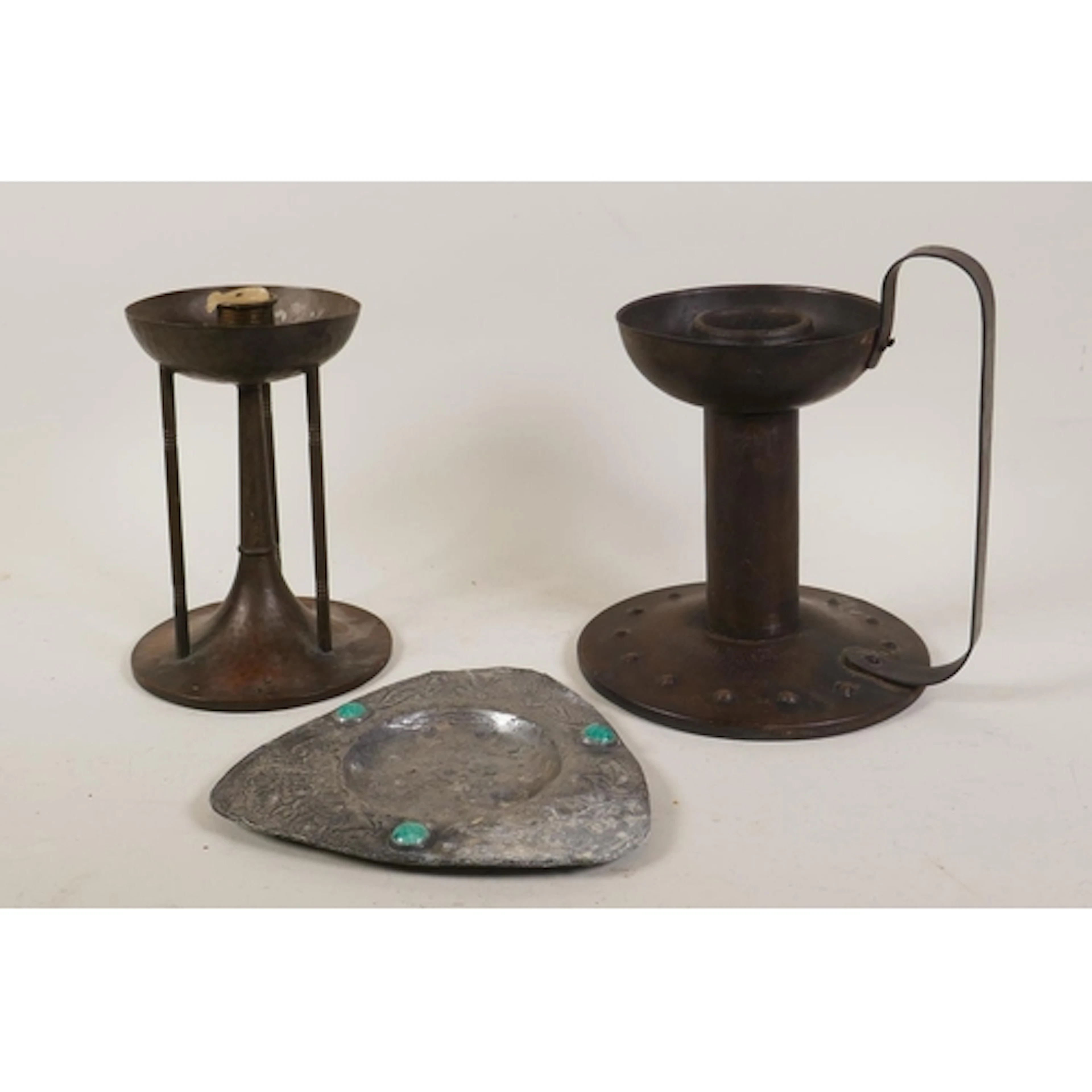 A Goberg Arts & Crafts steel chamberstick, 19cm high, a ...