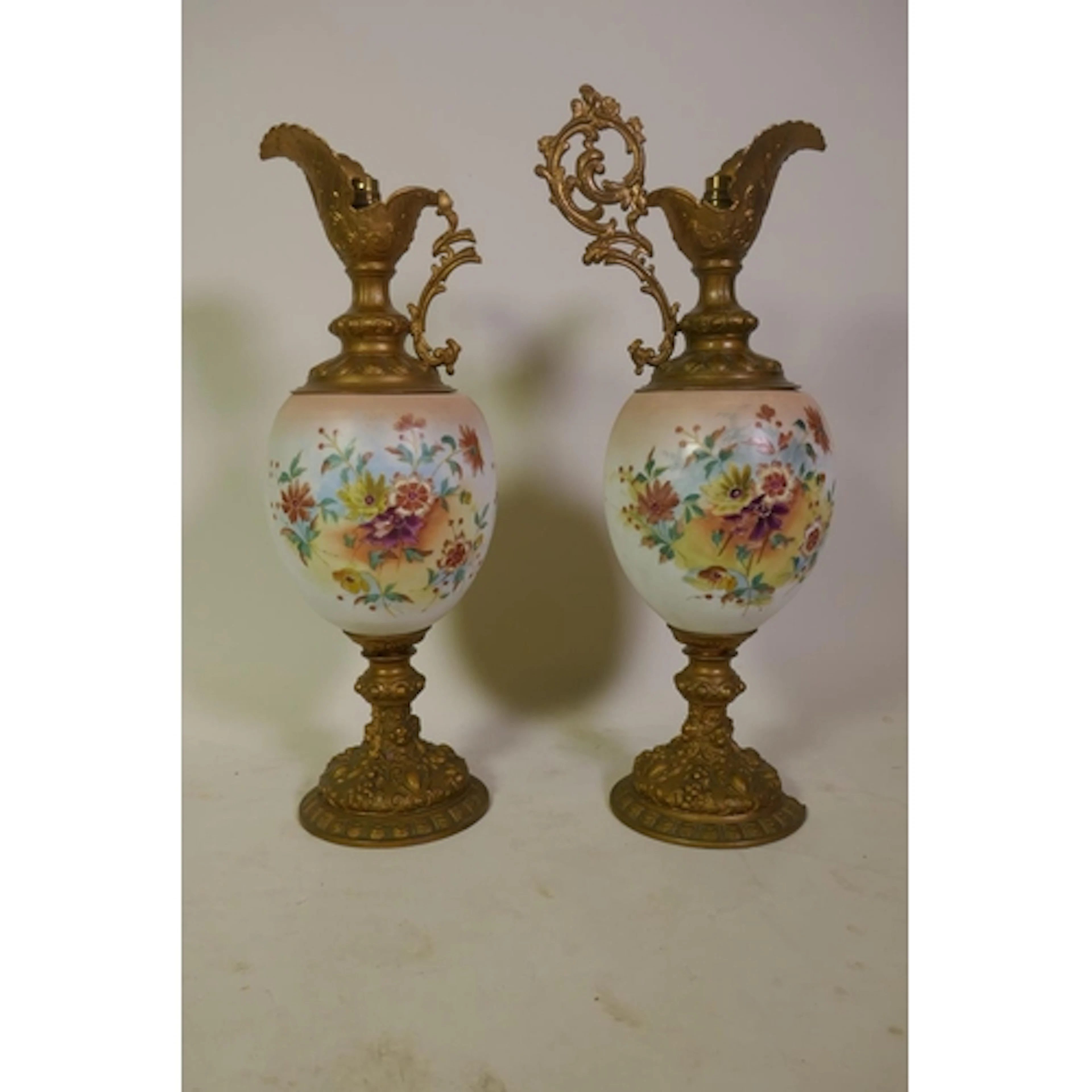Pair of Victorian opaline glass and gilt metal ewer shaped v...