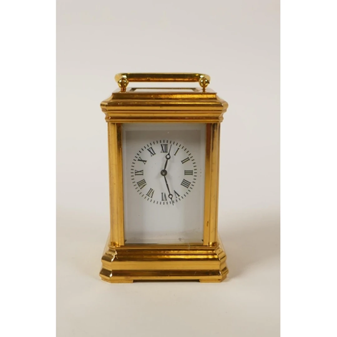 A miniature gilt brass cased carriage clock, 8cm high
