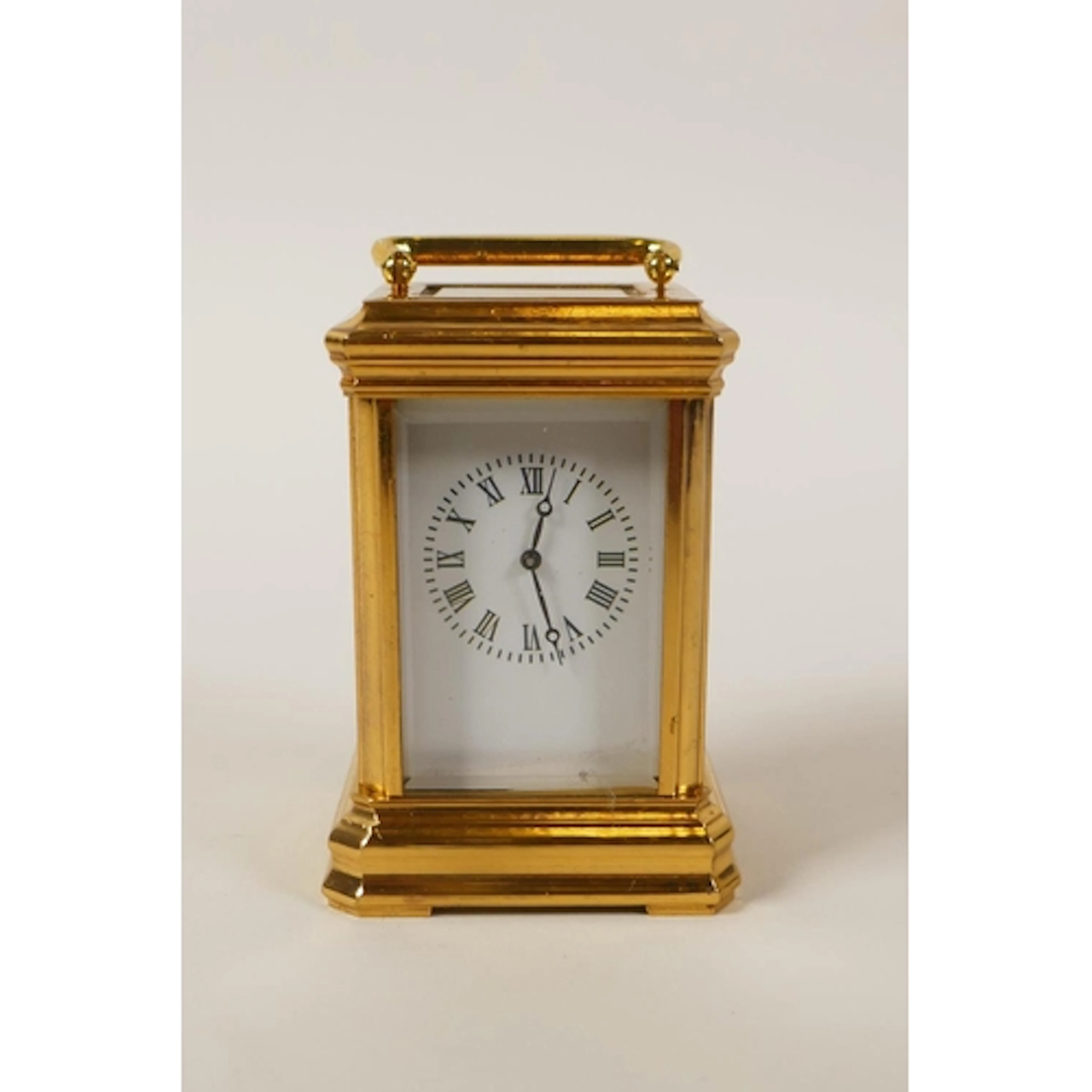 A miniature gilt brass cased carriage clock, 8cm high