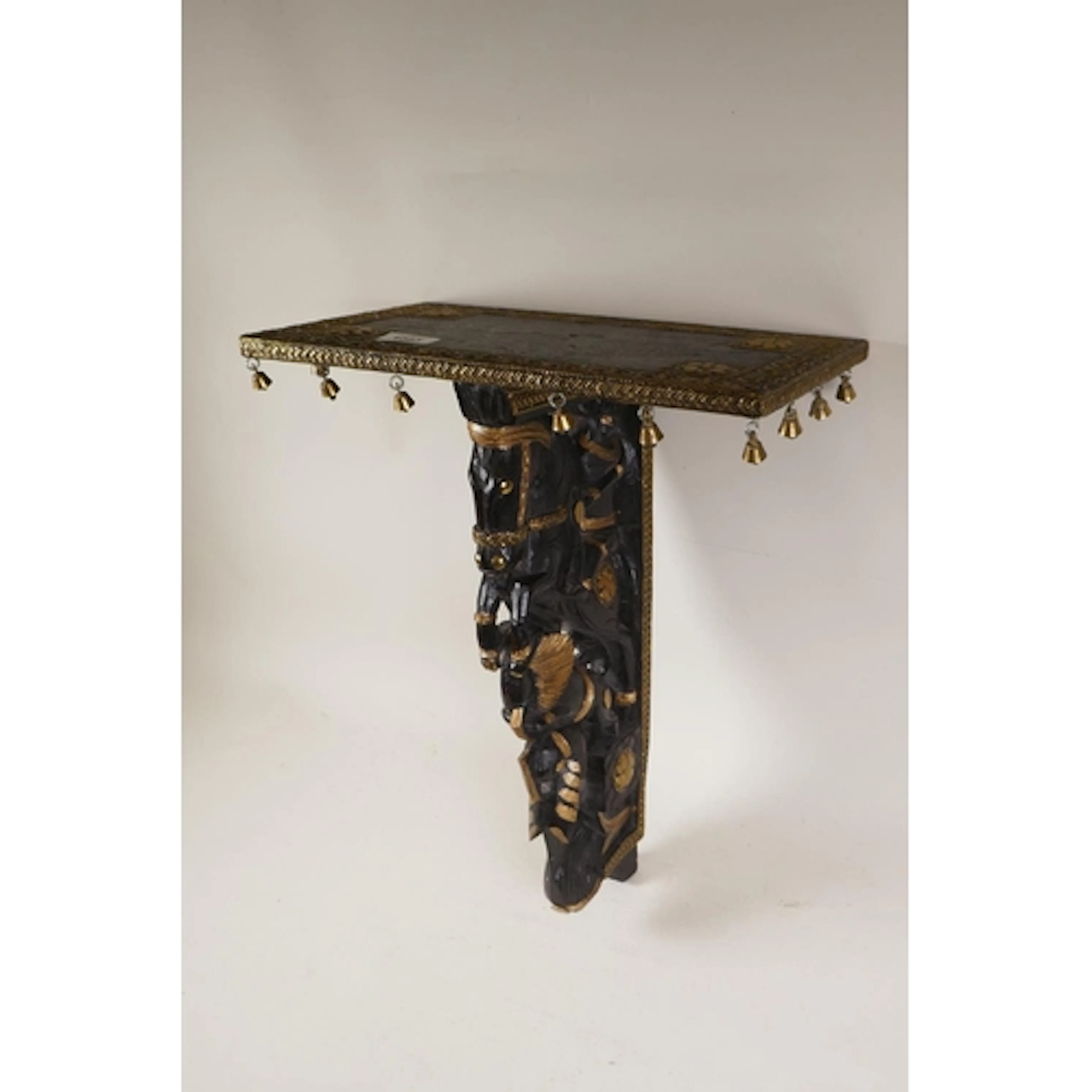 Anglo Indian ebonised wall bracket with brass mounts and car...