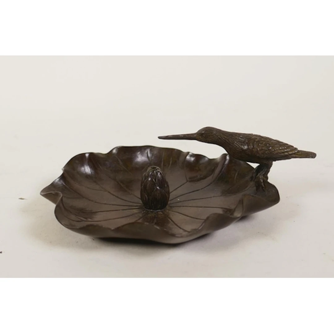 An oriental bronze incense holder in the form of a lily pad ...