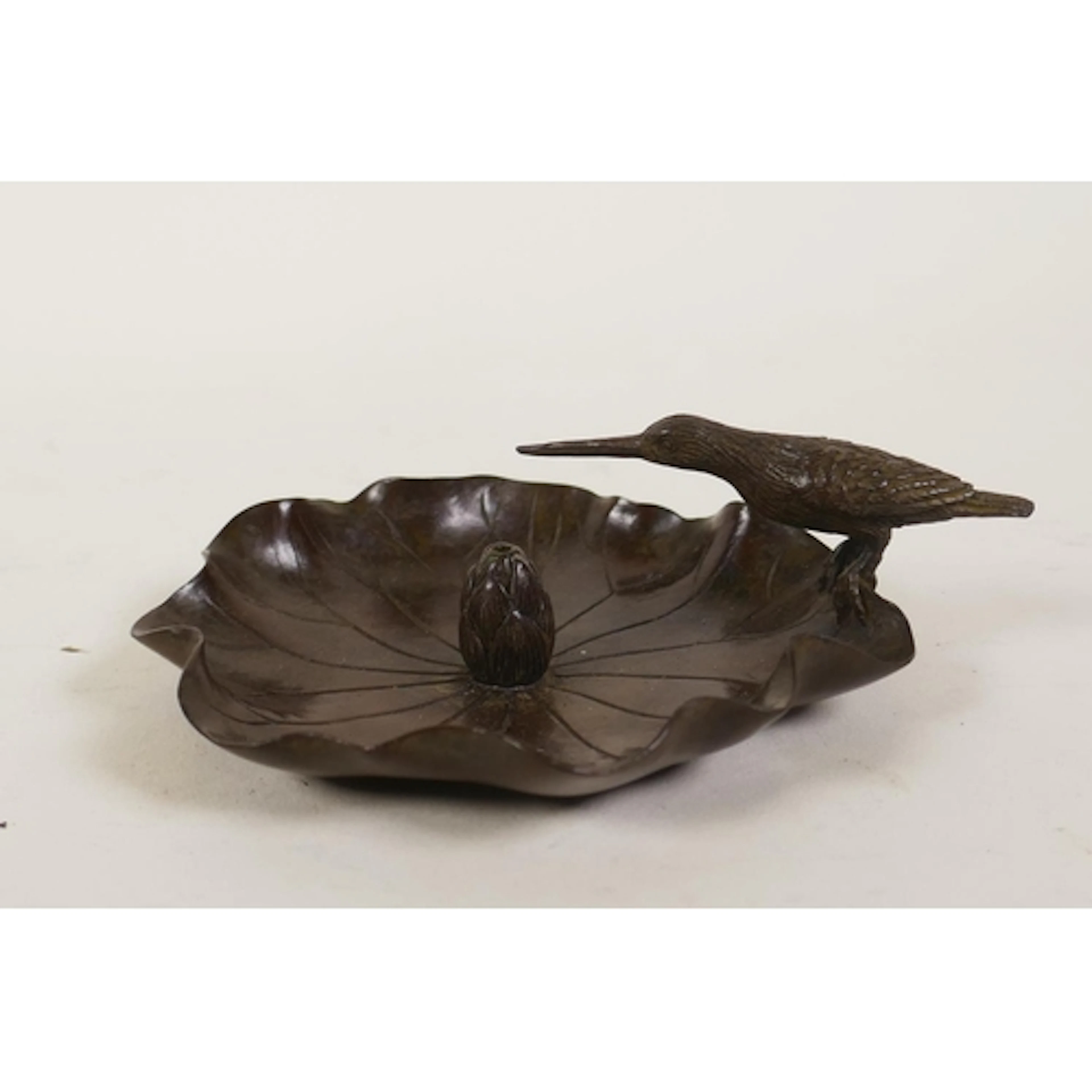 An oriental bronze incense holder in the form of a lily pad ...