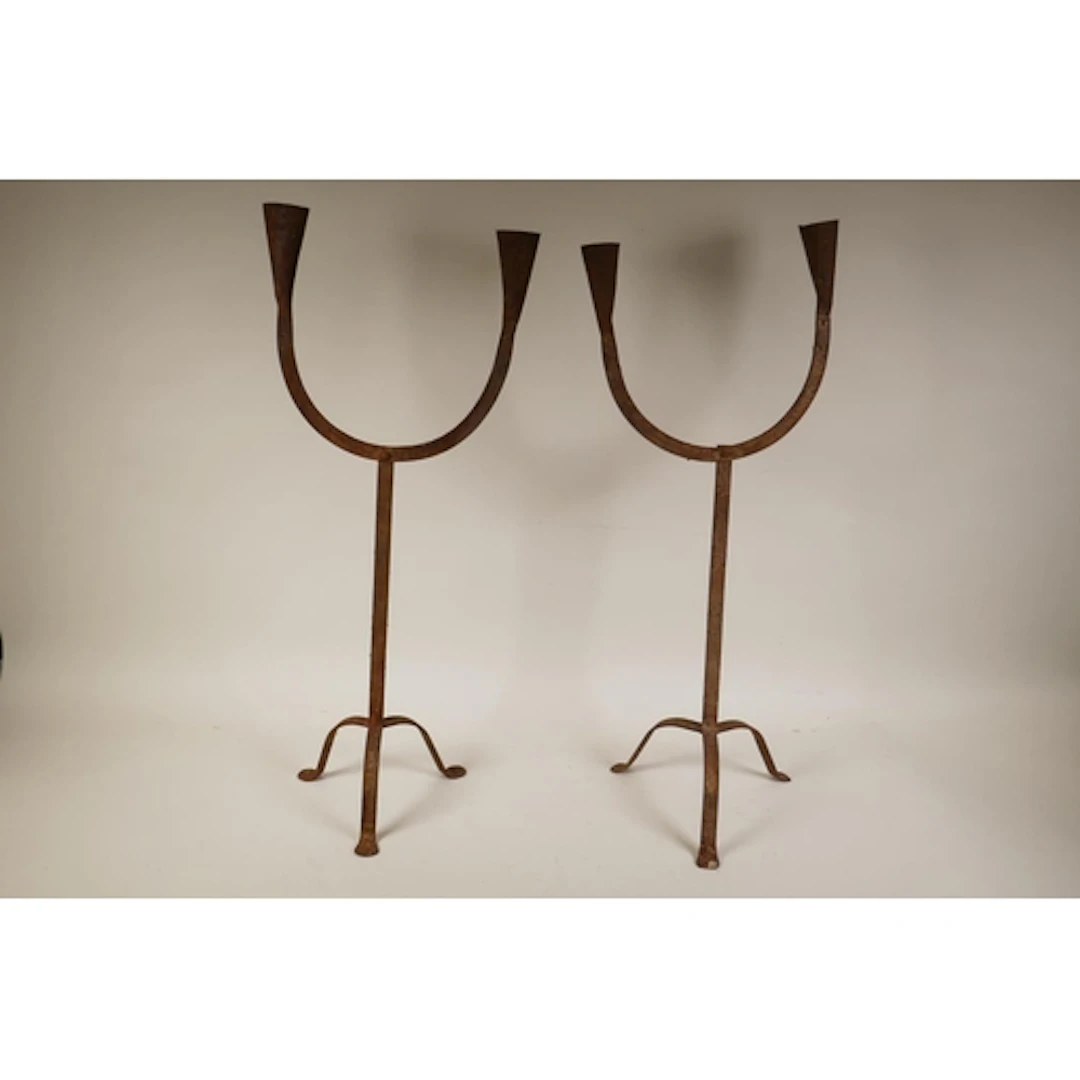 A pair of wrought iron folk art two branch candelabra, 62cm ...