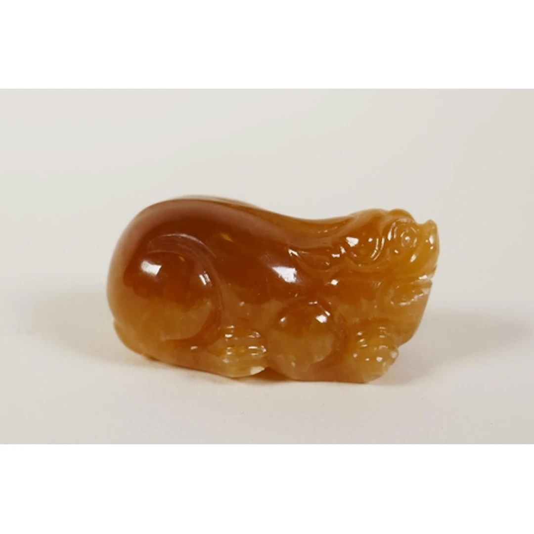 A Chinese carved hardstone/crystal pendant in the form of a ...