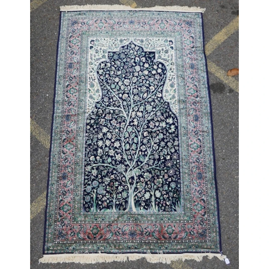 A Persian style bamboo silk rug with traditional tree of lif...