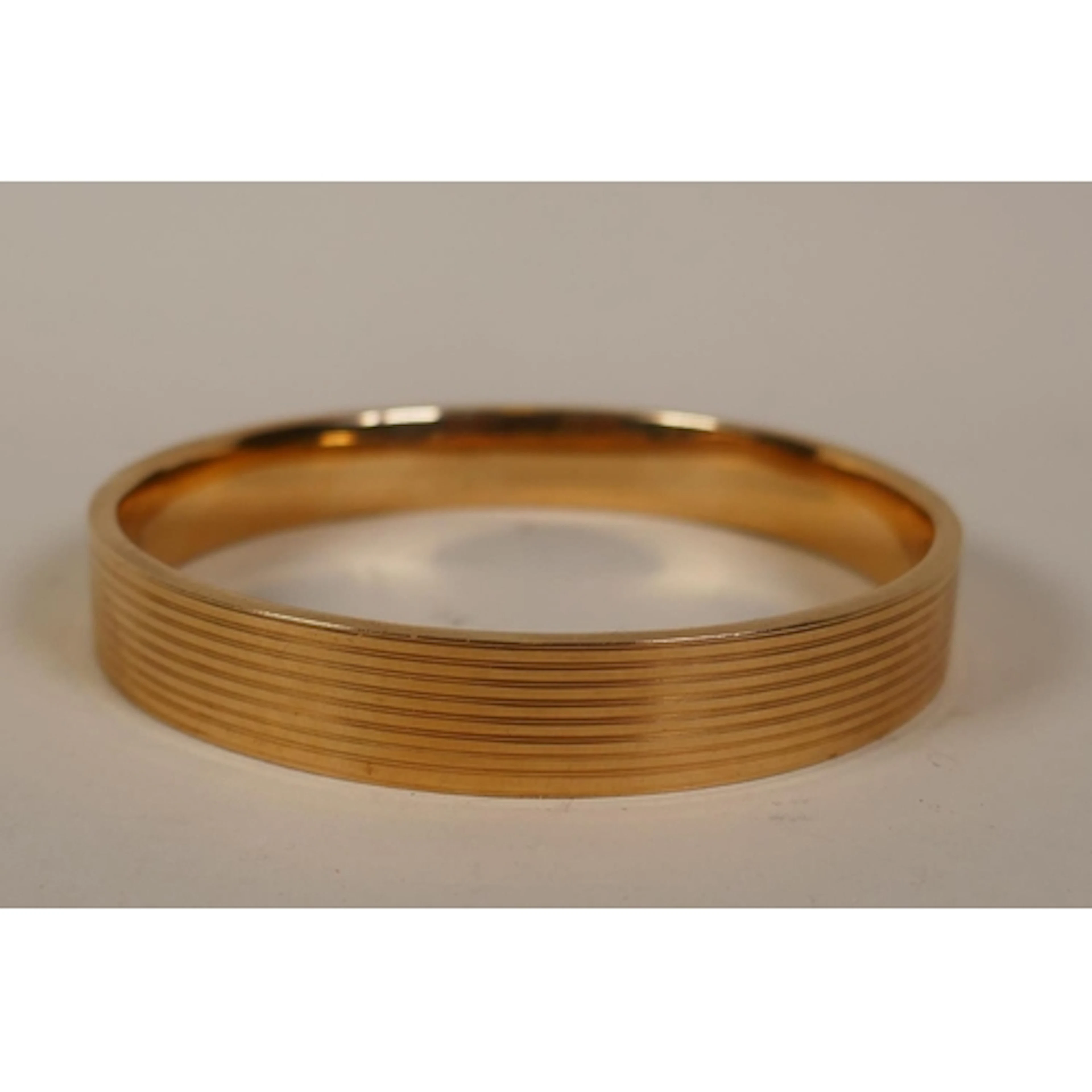 A 15ct gold bangle, marked HG&S, 8cm internal diameter, ...