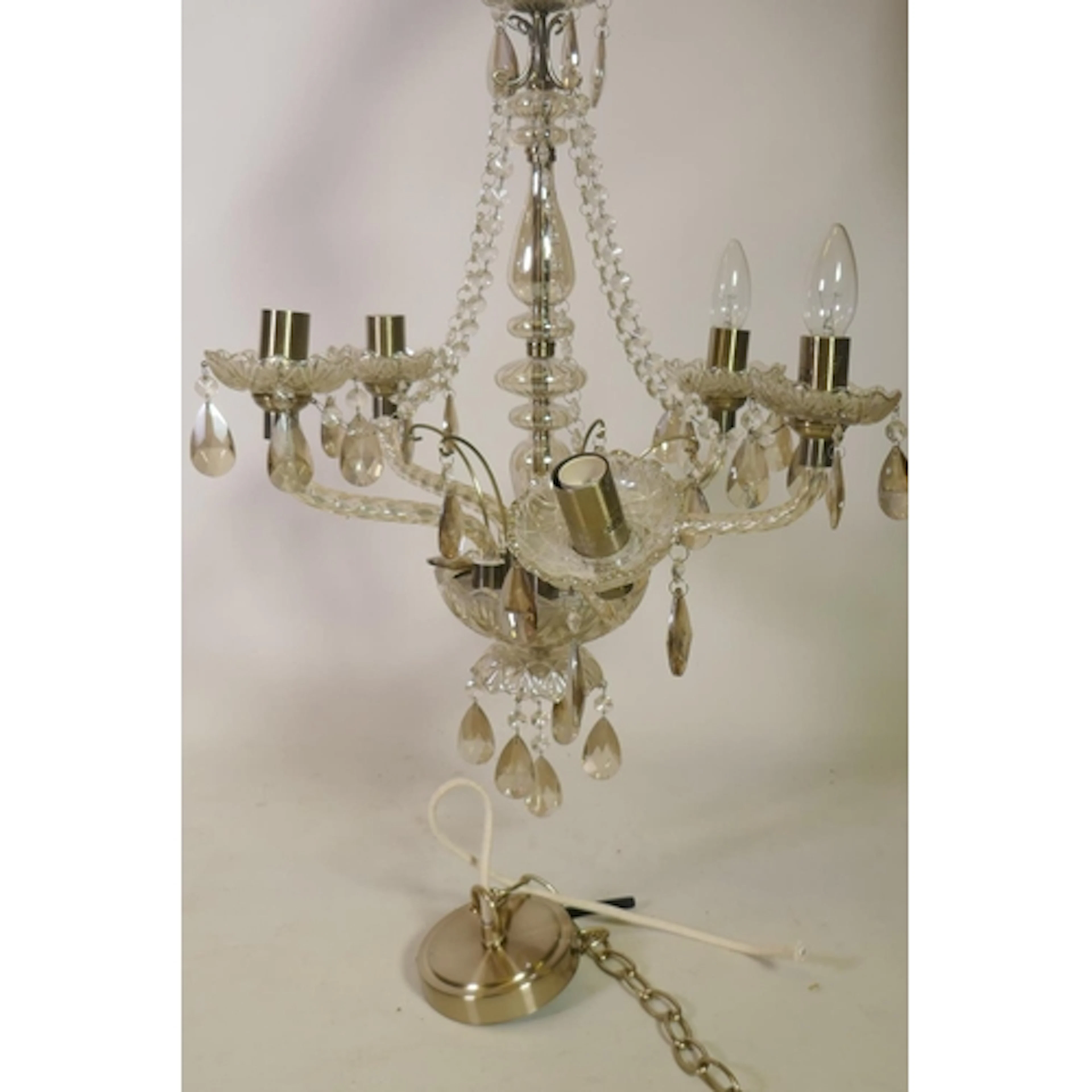 A five branch glass chandelier with lustre drops, one arm AF...