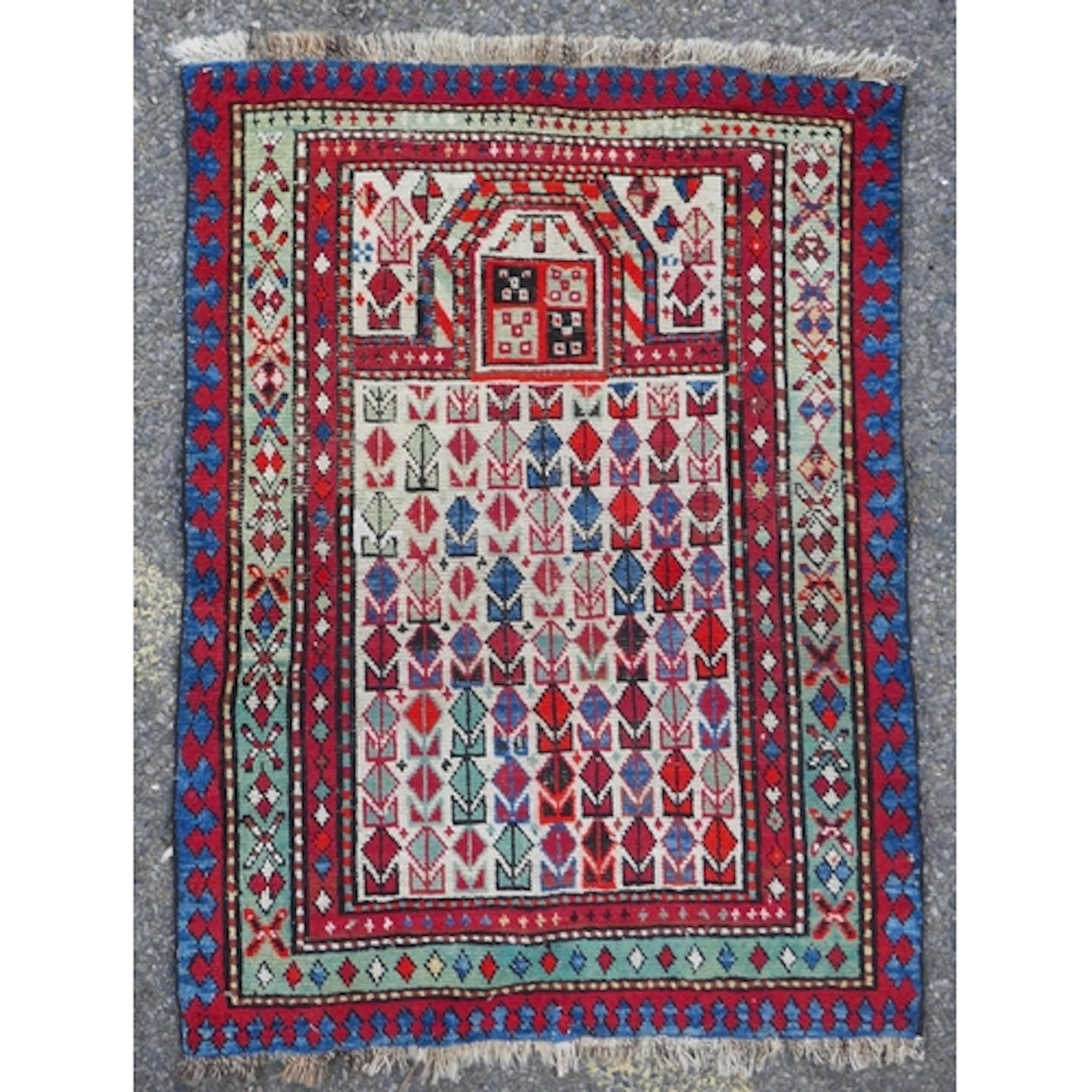 A Caucasian multi-colour wool prayer rug, 76 x 98cm
