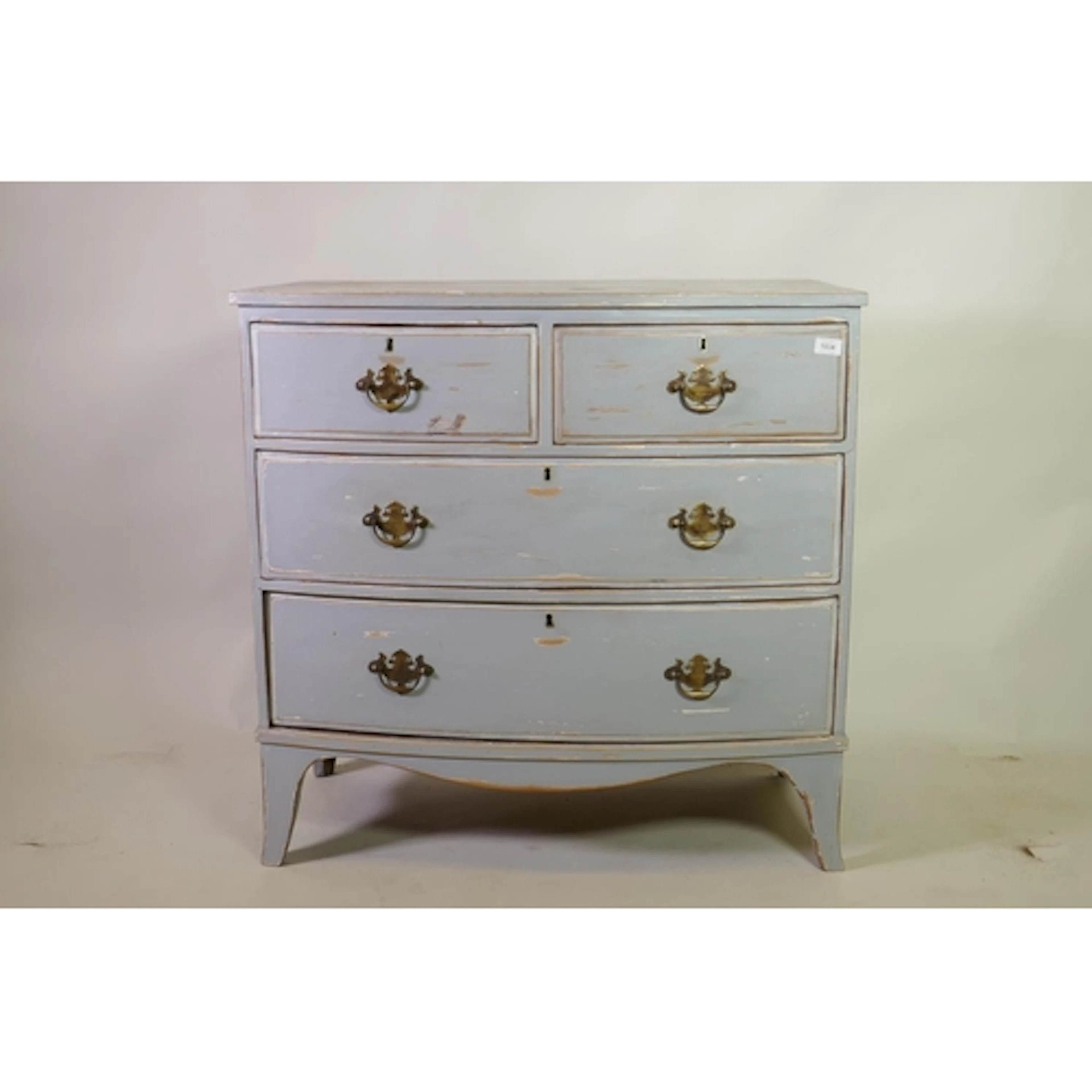 A C19th painted pine bowfront chest of two over two drawers,...