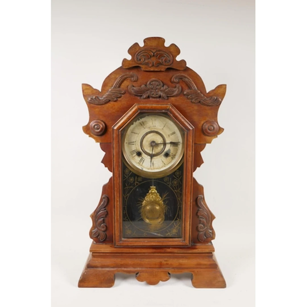 An antique American Gingerbread mantel clock, the enamelled ...
