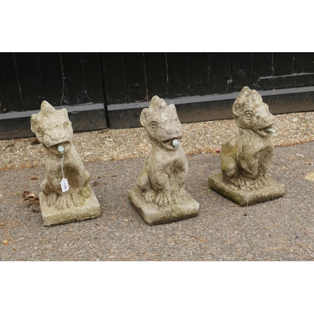 Three cast stone gargoyle fountain heads, 40cm high