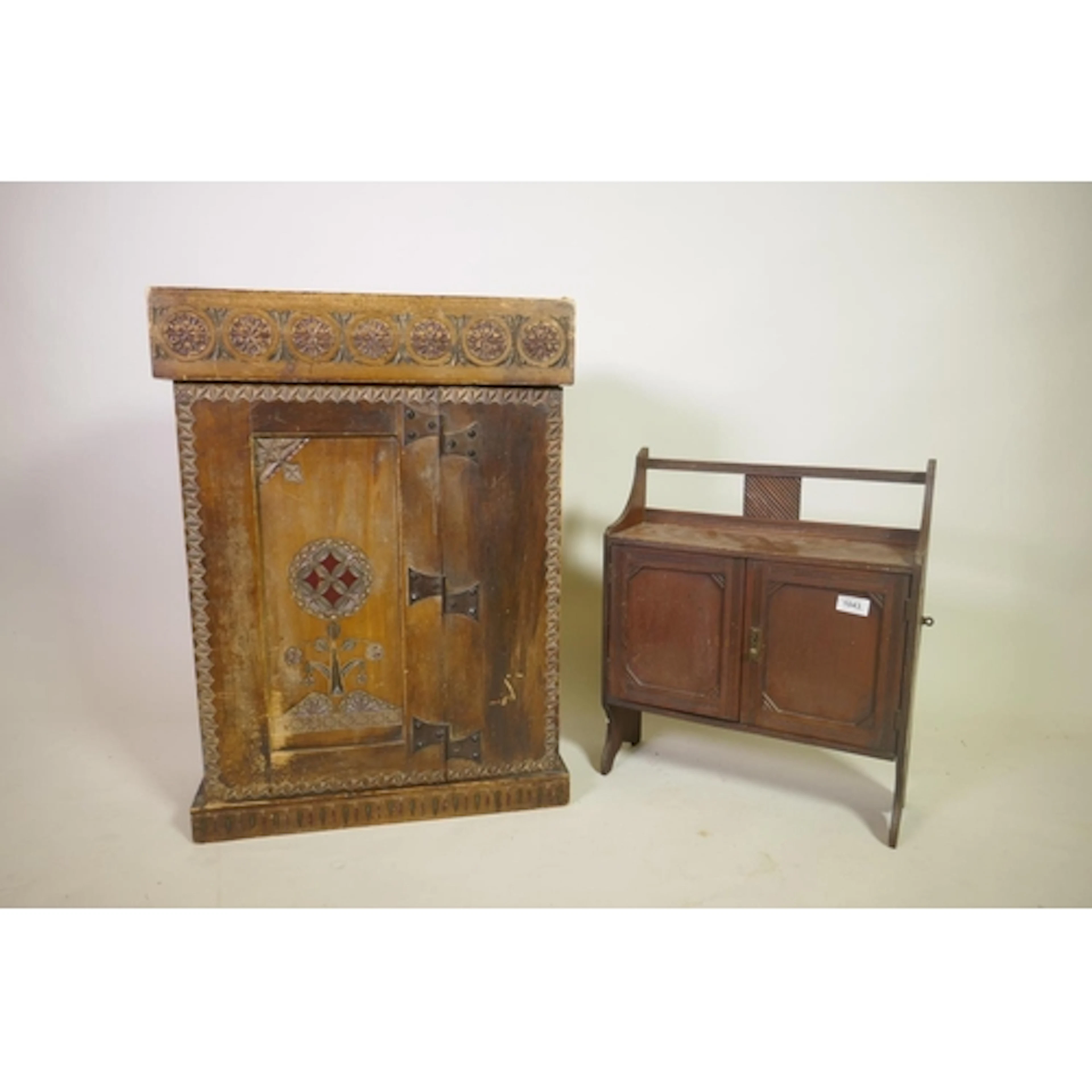 A C19th East European hanging cupboard with carved and paint...