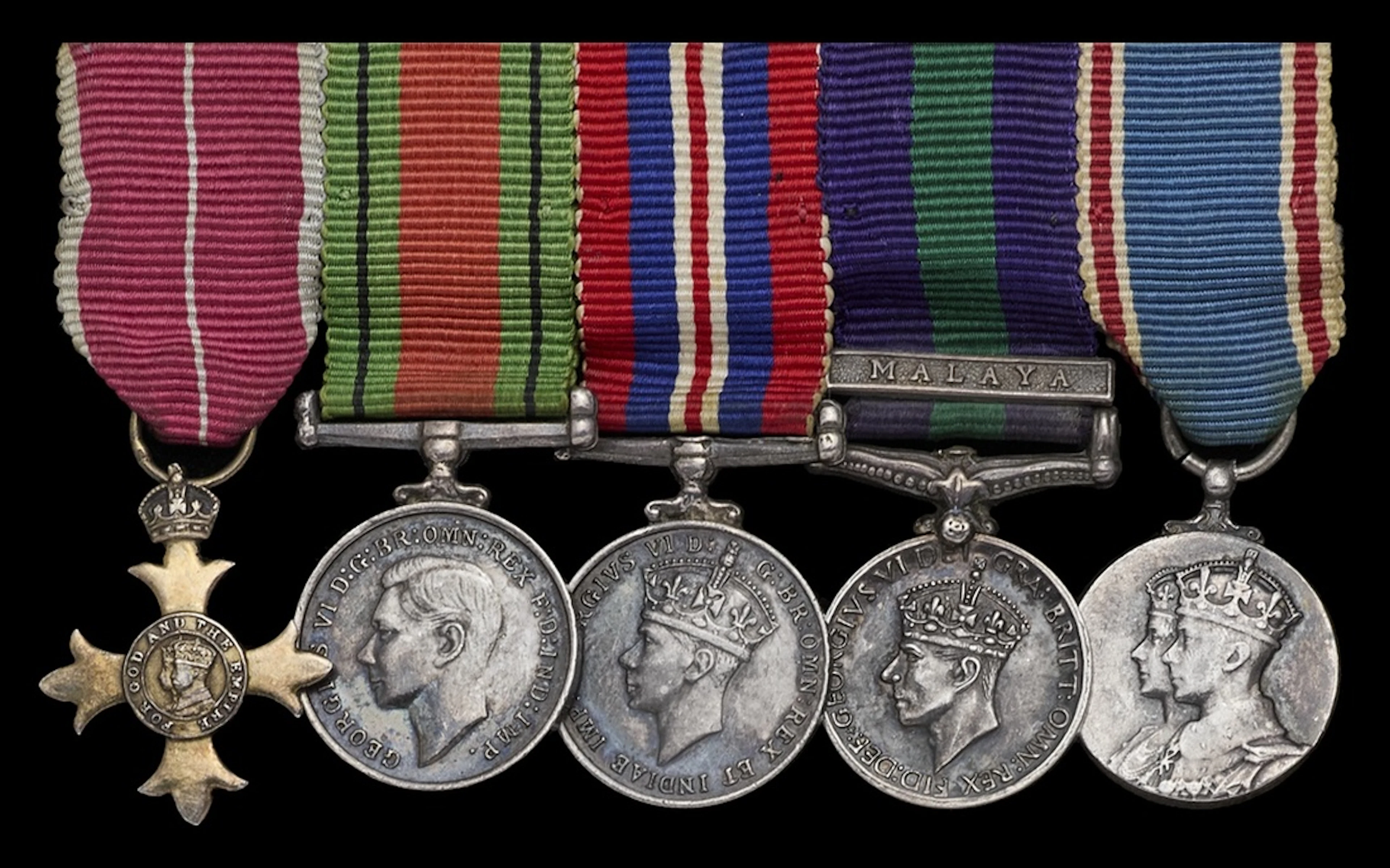 The mounted O.B.E. group of five miniature dress medals worn by Wing