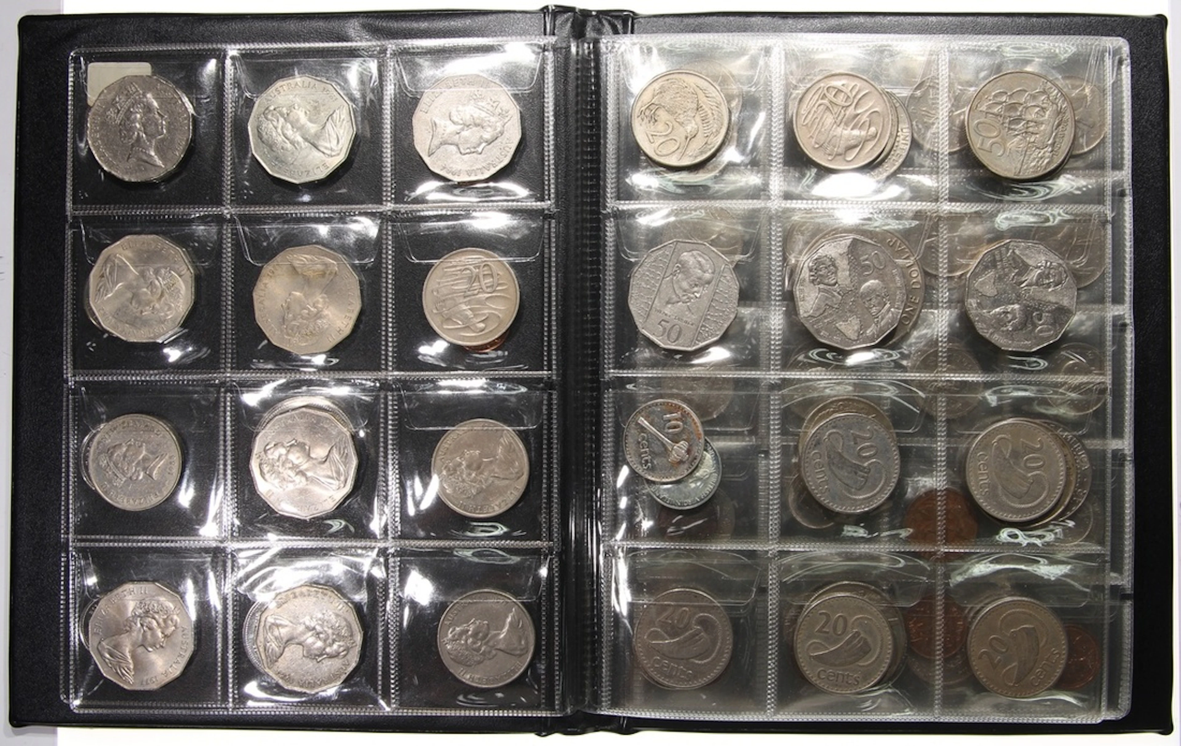 World Coins, an album of 130+, including US, Canada, Australia and New Zealand