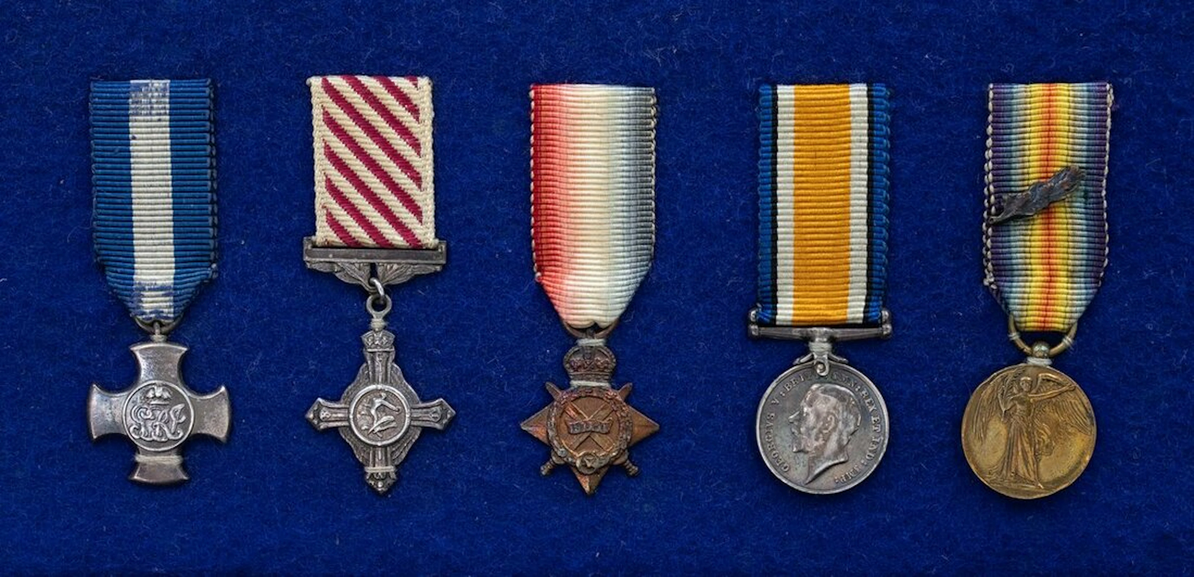 The mounted D.S.C., A.F.C. group of five miniature dress medals attibuted