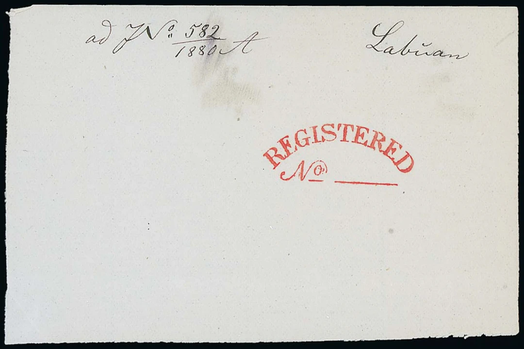 Labuan A large piece (100x65mm) with a proof strike of "registered/no"