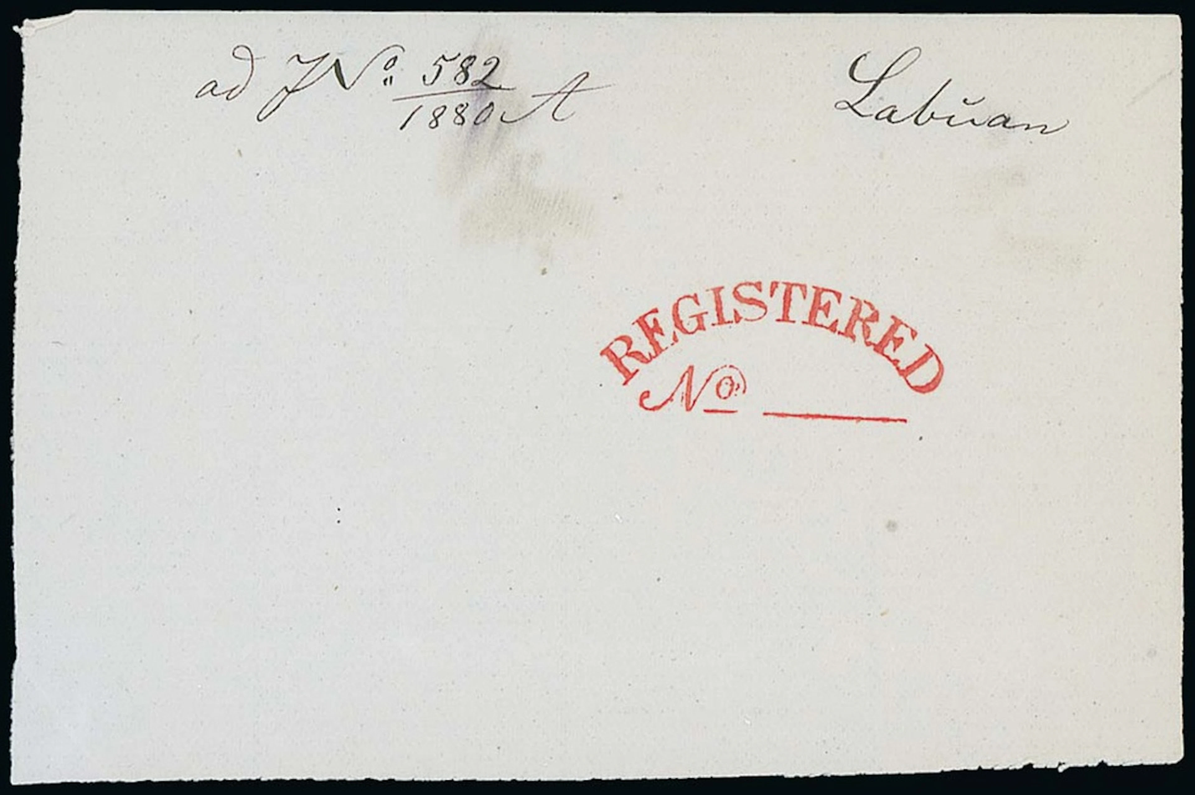 Labuan A large piece (100x65mm) with a proof strike of "registered/no"
