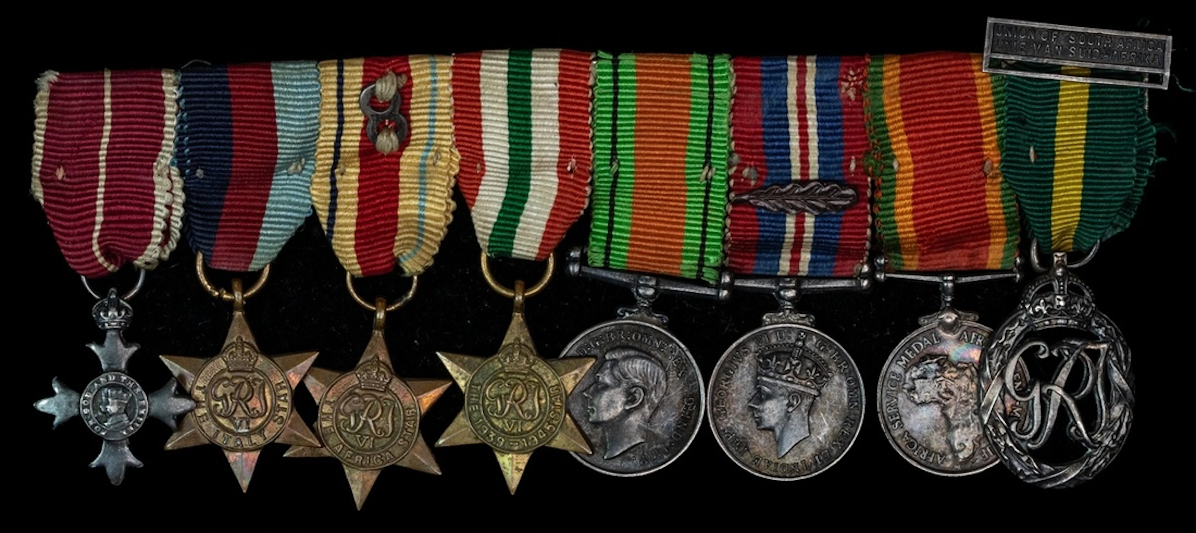 The mounted M.B.E. group of eight dress miniatures attributed to Major