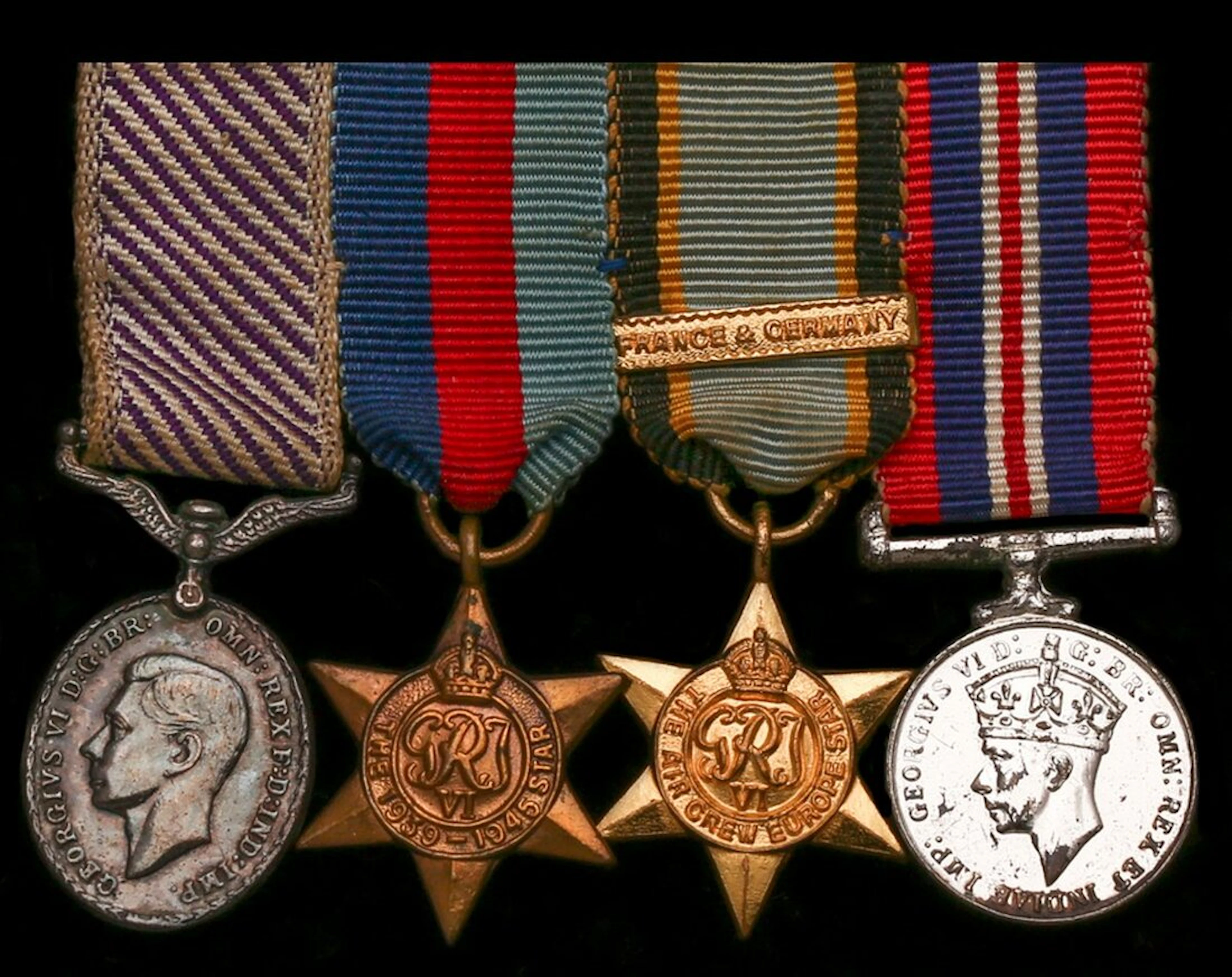 The mounted D.F.M. group of four miniature dress medals and archive