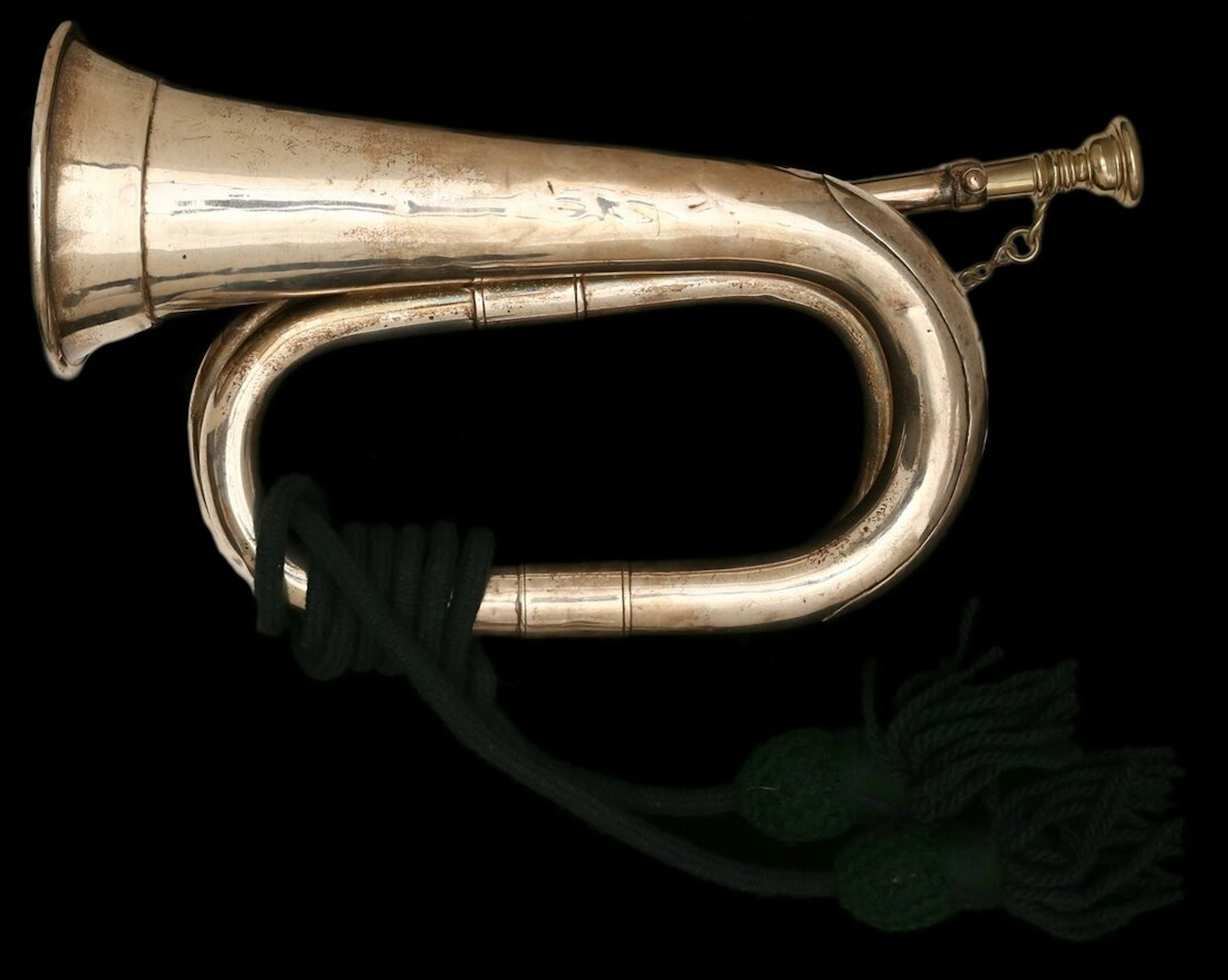 A silver Presentation Bugle presented by the Cowan family to the Highland