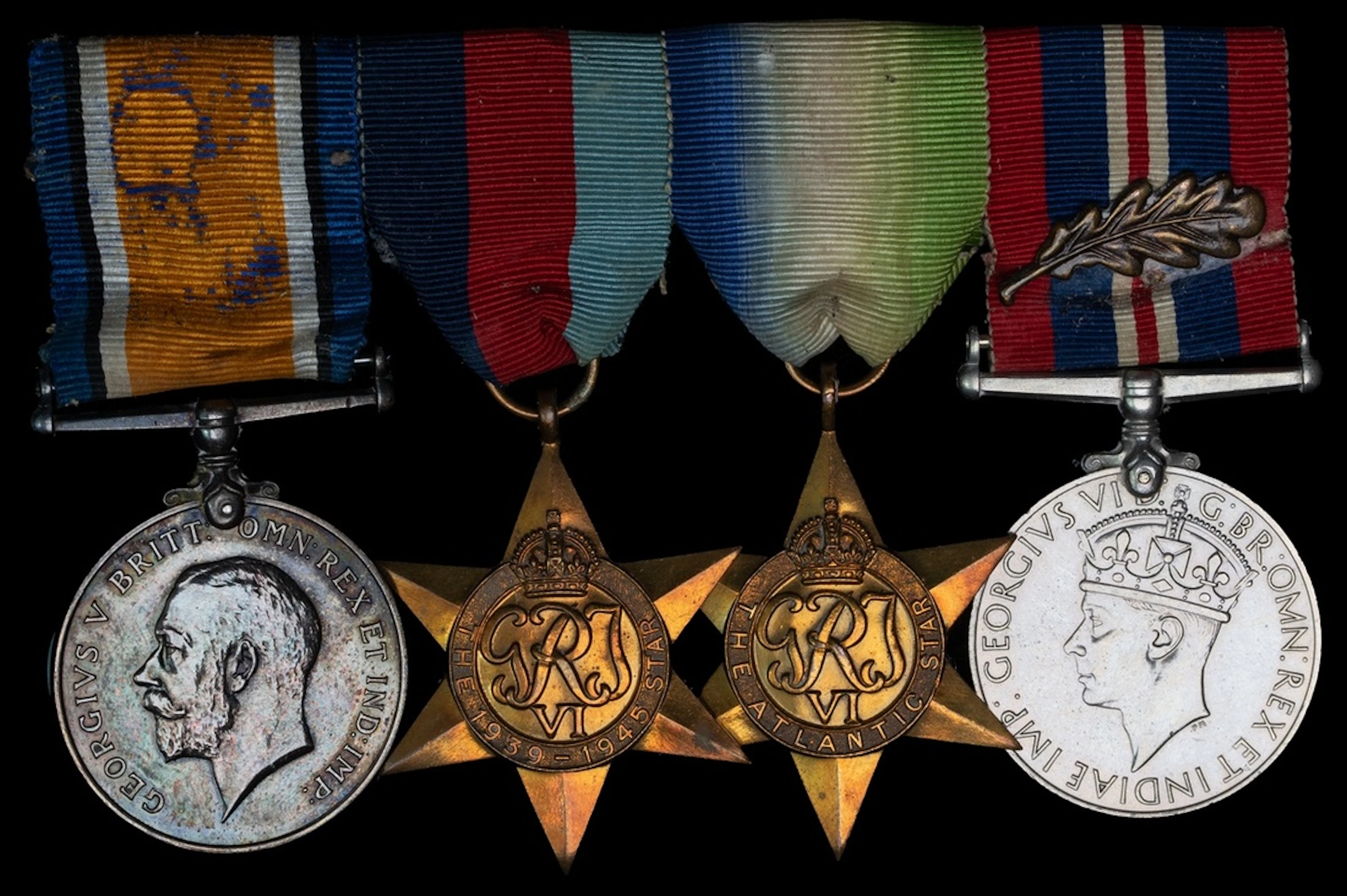 Four: Gunner H. W. Donald, Merchant Navy, who was commended for his