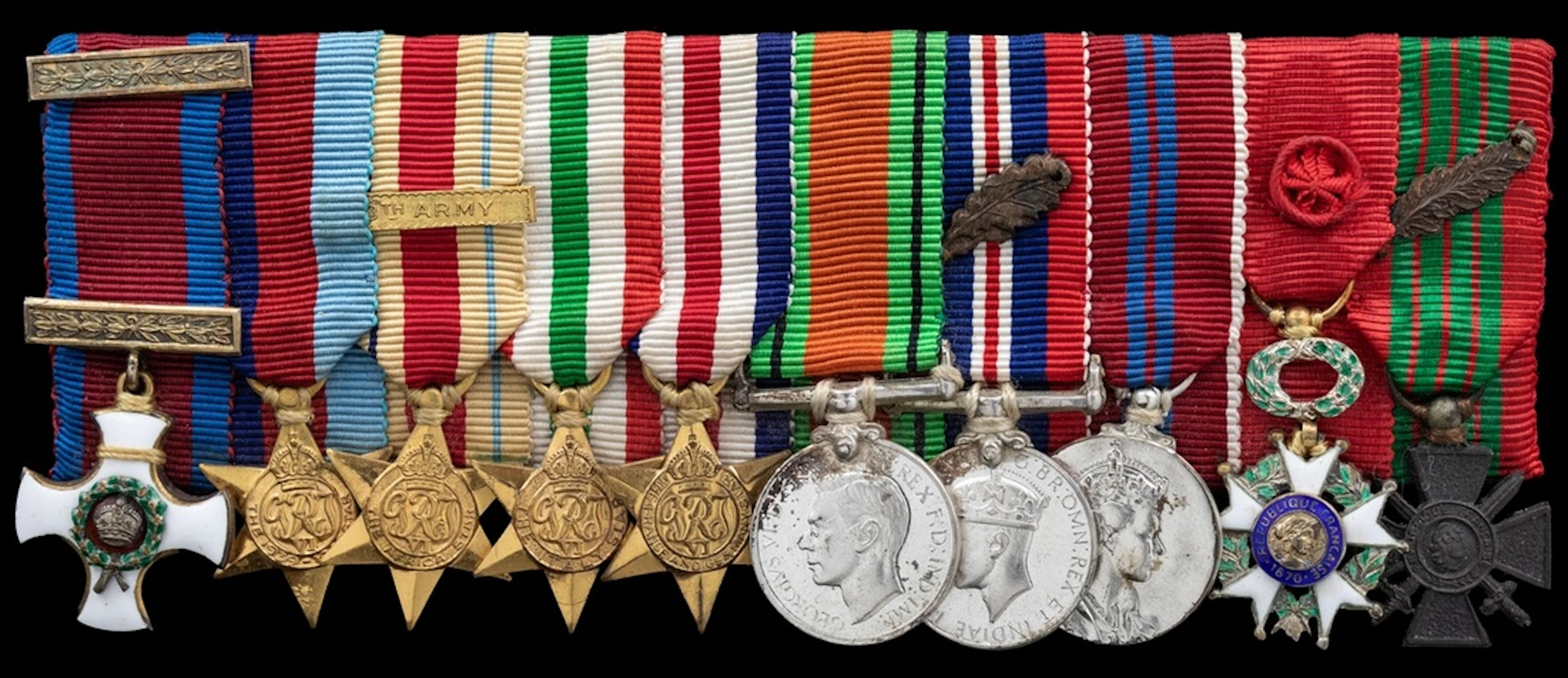 The impressive mounted D.S.O. group of ten miniature dress medals...