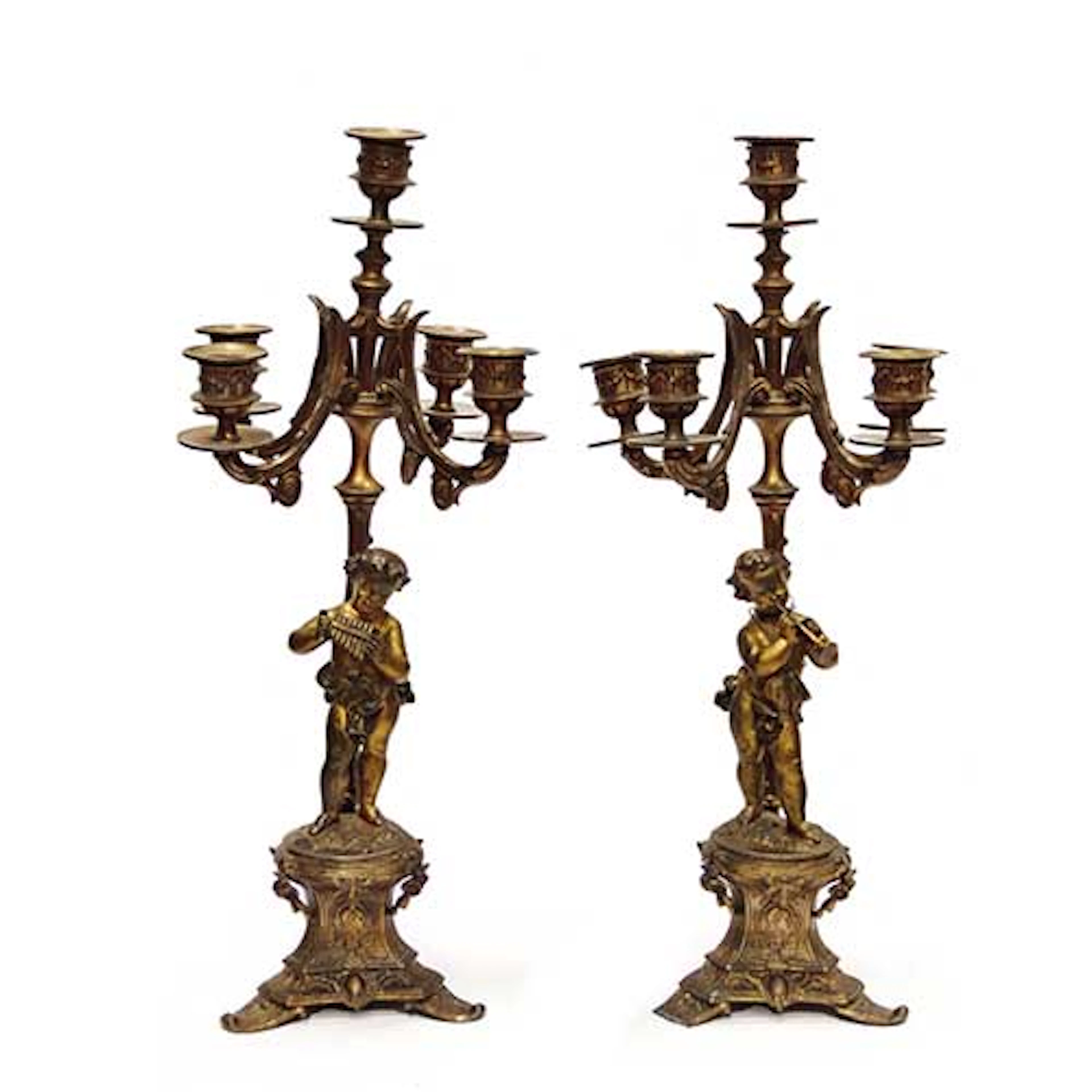 Pareja de candelabros de seis luces con nios msicos en calamina