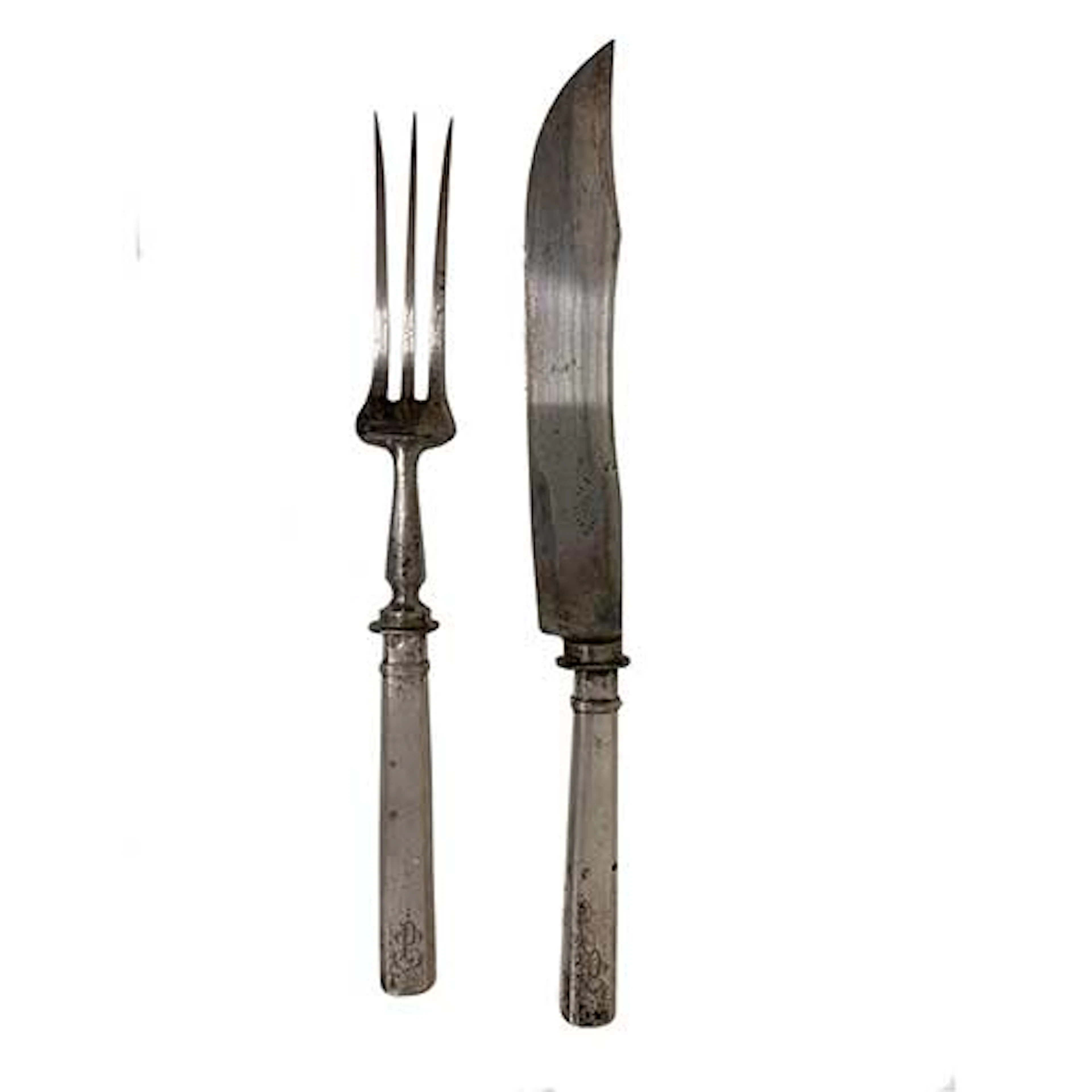 Cuchillo y tenedor de trinchar realizados en plata.