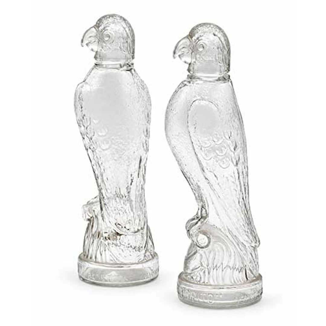 Dos botellas de licor en cristal prensado, Destilerias El Lorito Benetuser
