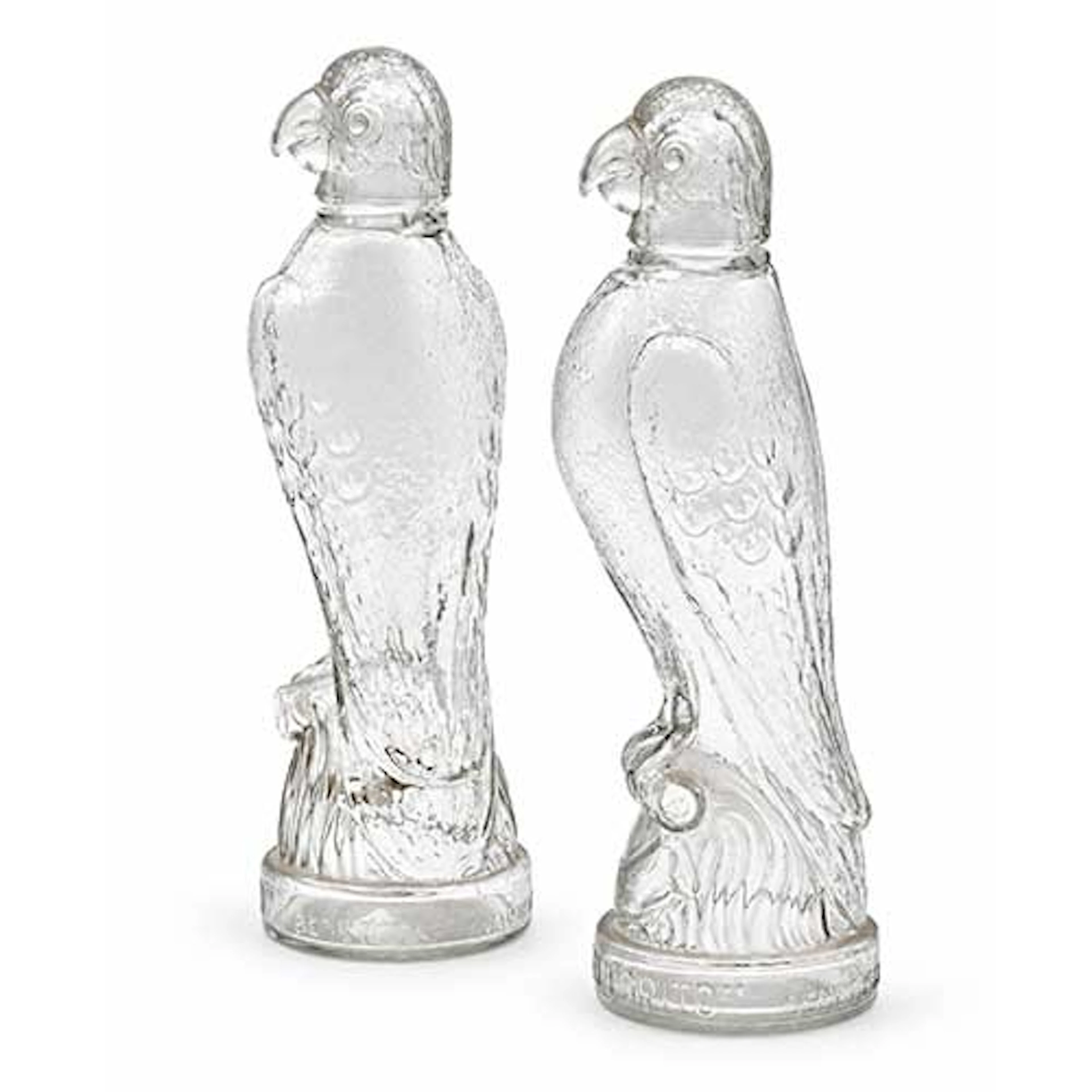 Dos botellas de licor en cristal prensado, Destilerias El Lorito Benetuser