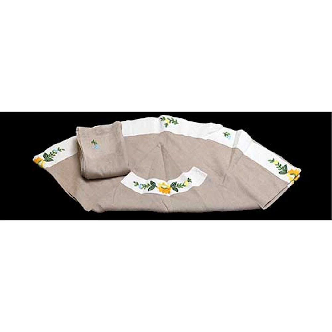 Mantel redondo con motivos florales bordados y ocho servilletas.